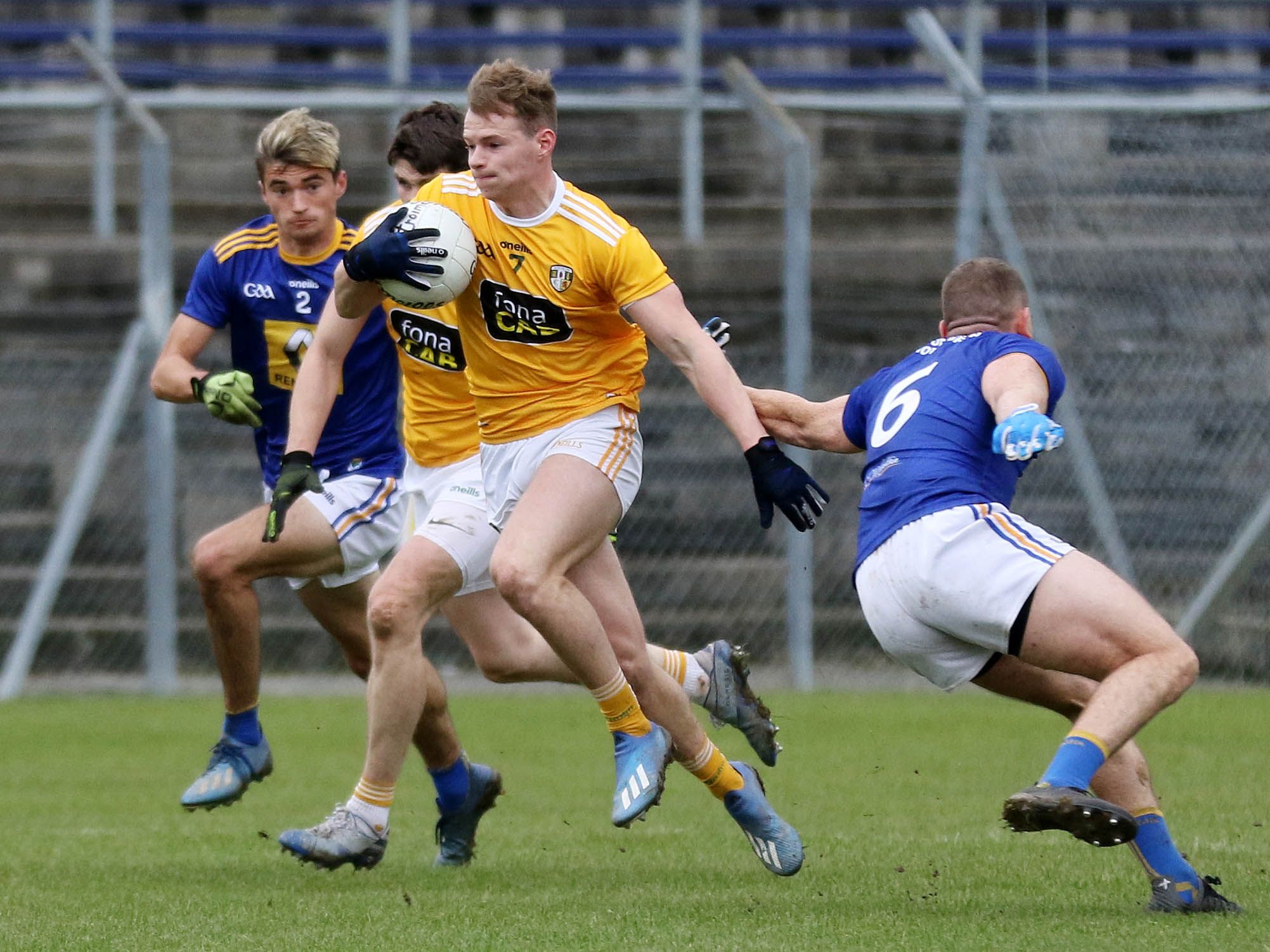Antrim defender Peter Healy gets away from Wicklow\'s Niall Donnelly 