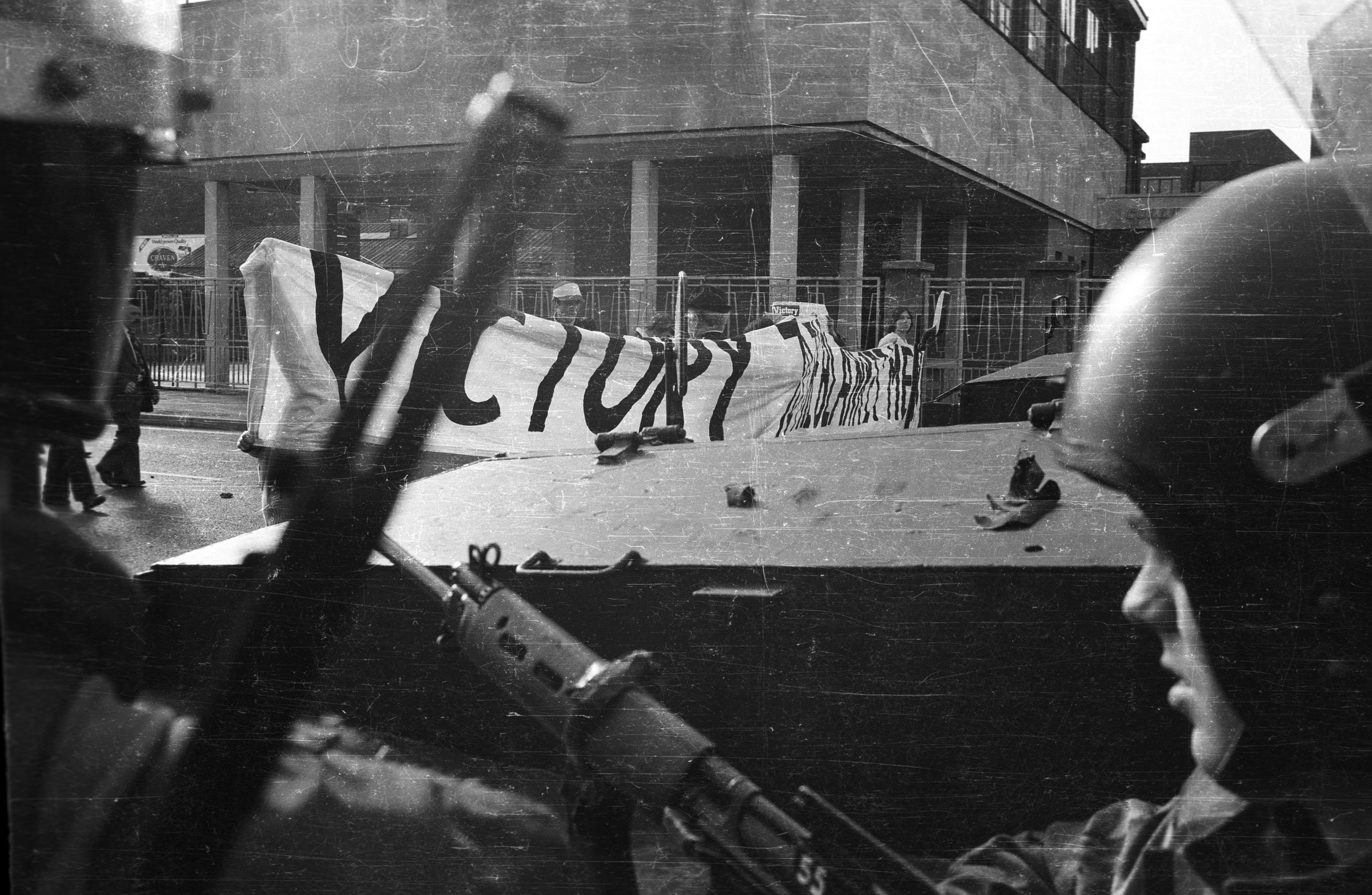 LEGACY REPORT: British soldiers watching a Victory to the Blanket Men march on the Andersonstown Road in September 1979