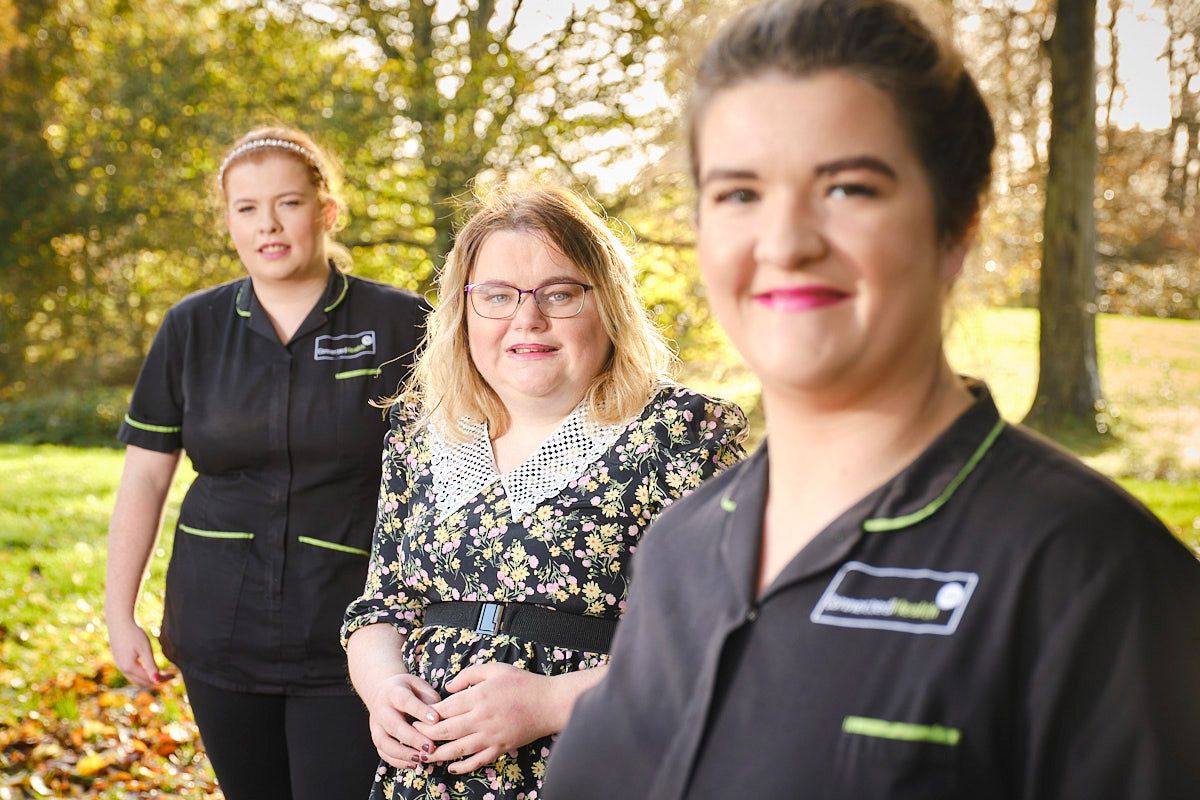 TEAMWORK: Connected Health care assistants, sisters Lauren and Chloe Kelly, with Laura Magee who they moved in with after she tested positive in October for Covid-19