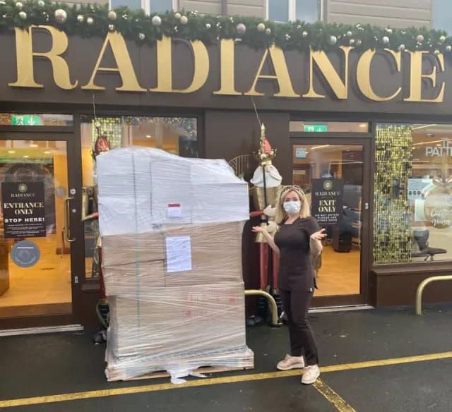 NEW STOCK: A delivery of skincare and Christmas giftsets arrives for Radiance owner Christine Mackin, just as lockdown begins again