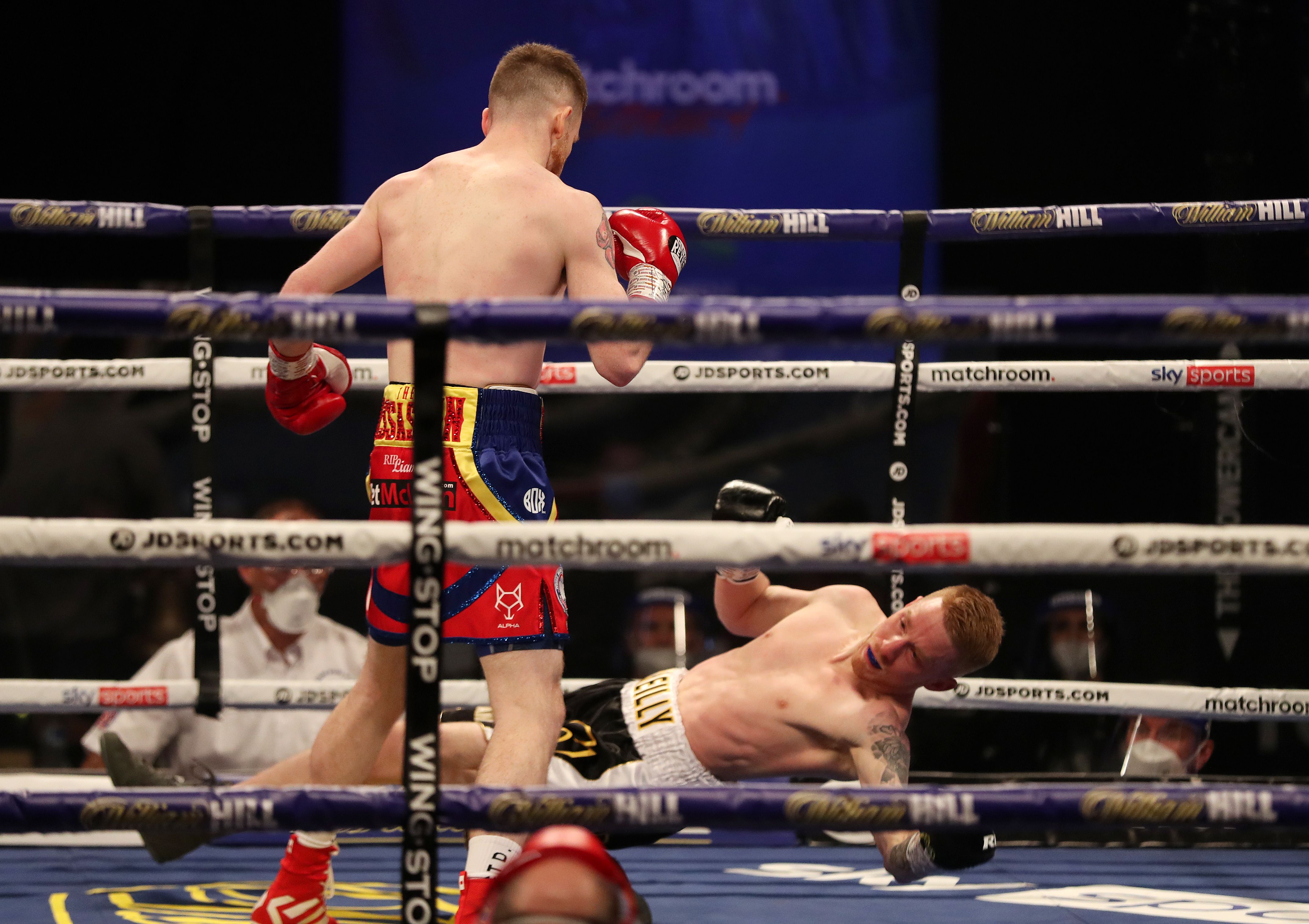Josh O’Reilly is dropped to the canvas by James Tennyson in their WBA lightweight title eliminator on Friday