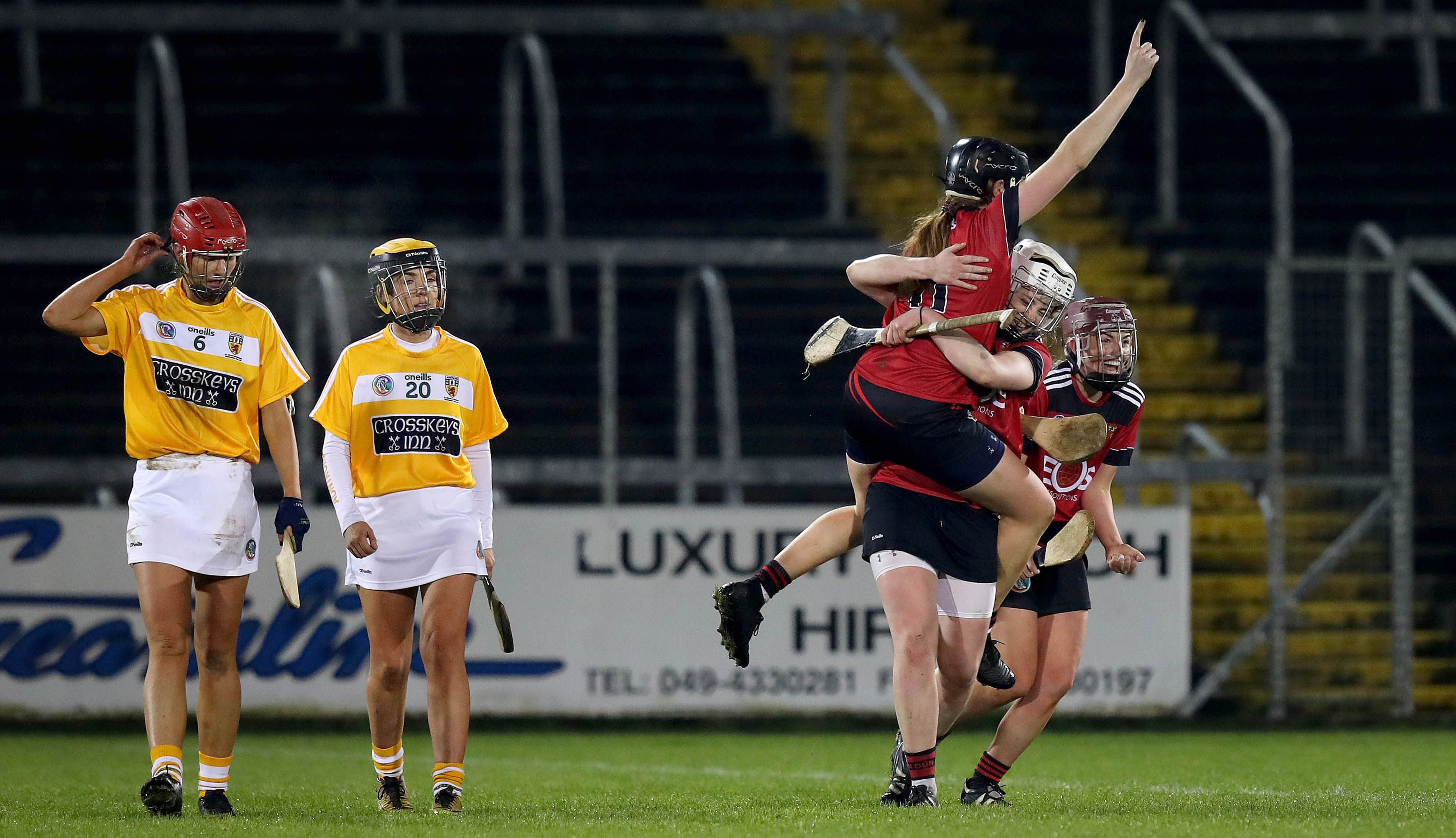Agony and ecstasy: Antrim\'s Maeve Connolly and Niamh Anne Donnelly can only look on as Down duo Sara Louise Graffin and Sorcha McCarton celebrate after the game