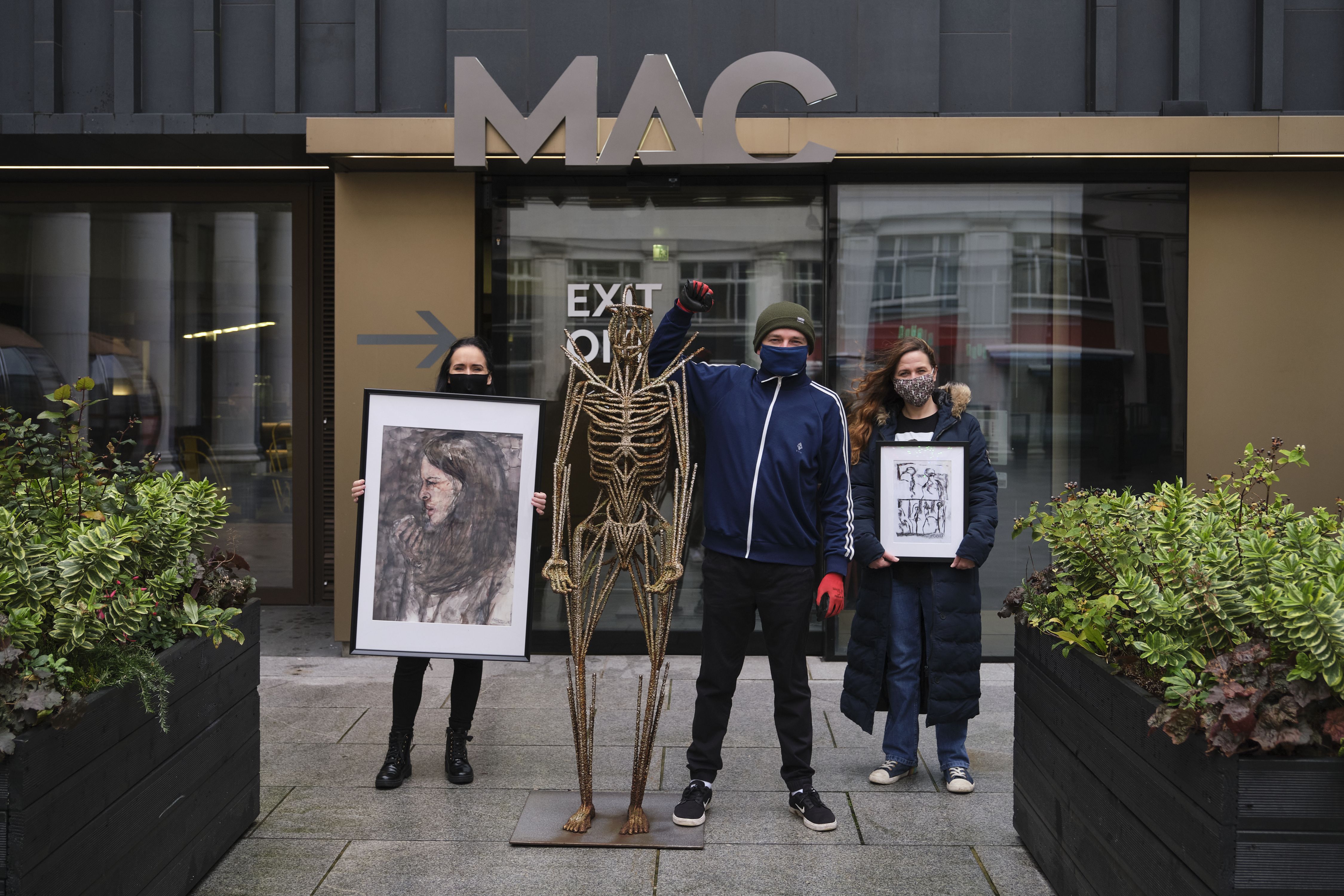 TEAMWORK Fionnuala Kennedy, Gareth Moore and Louise Mathews helped auction off art for the H.E.A.R.T campaign