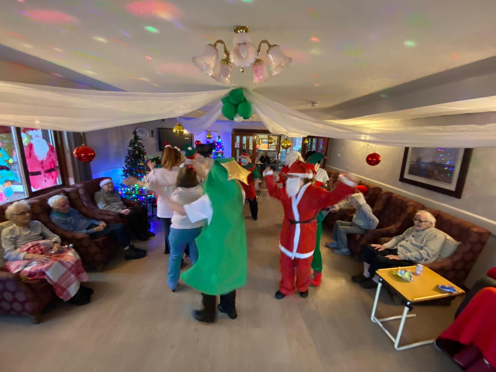 HAPPY CHRISTMAS: Letting their hair down at the Brooklands care home after a gruelling year for both staff and residents