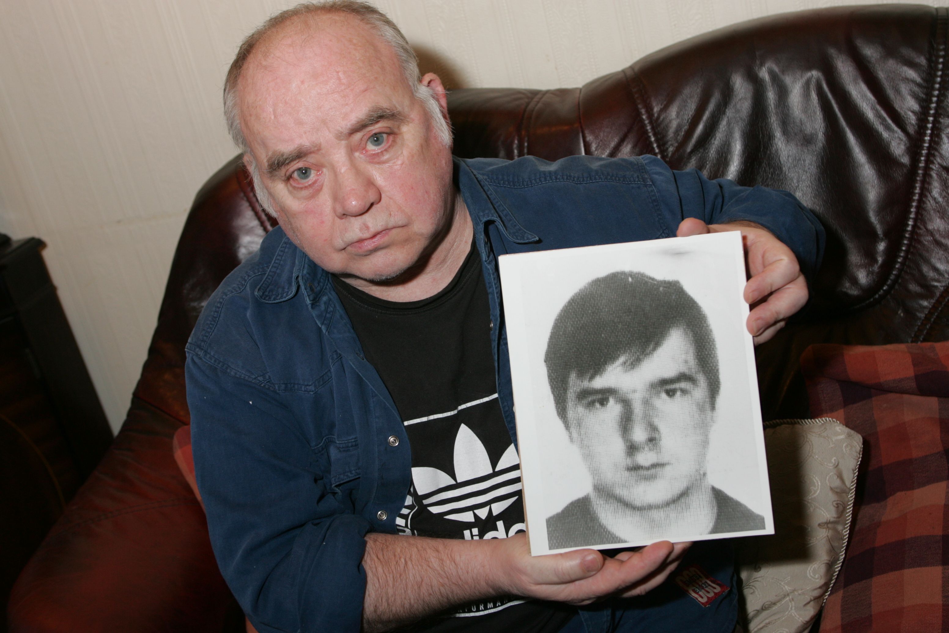 TRUTH: Hugh Jordan back in 2005 holding a photo of his son Pearse