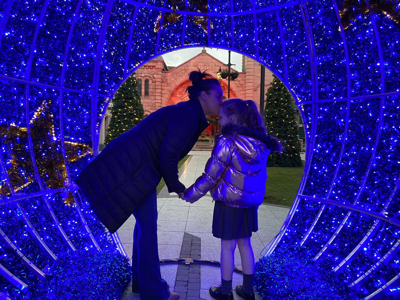 NOLLAIG SHONA: Christmas lights at St Mary\'s Church in Chapel Lane attracted city centre visitors to the Lady of Lourds grotto at the end of a tough year. 