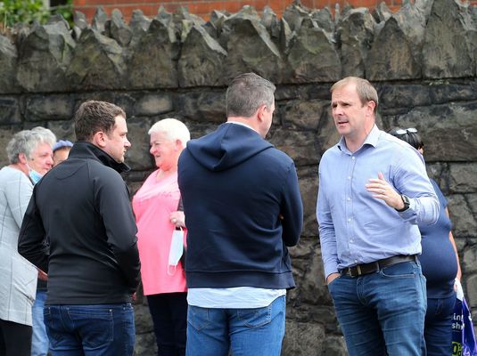 GATEKEEPER: Leading loyalist Winston \'Winky\' Irvine asks North Belfast MP John Finucane to leave a residents\' protest on the Crumlin Road