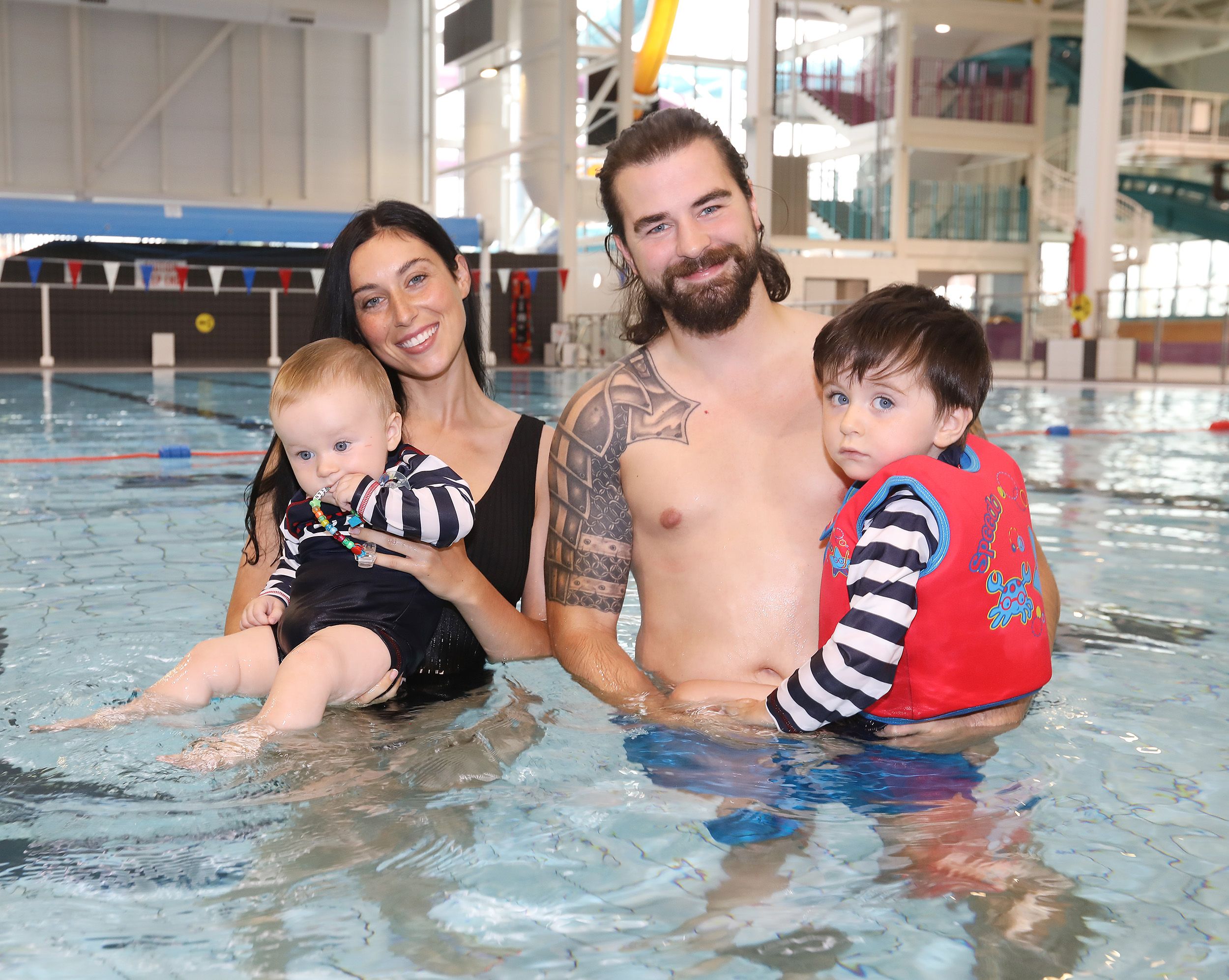 POOL TIME: James Fryers and Amy Steele with their children Sean and James in the new Andersonstown Leisure Centre pool