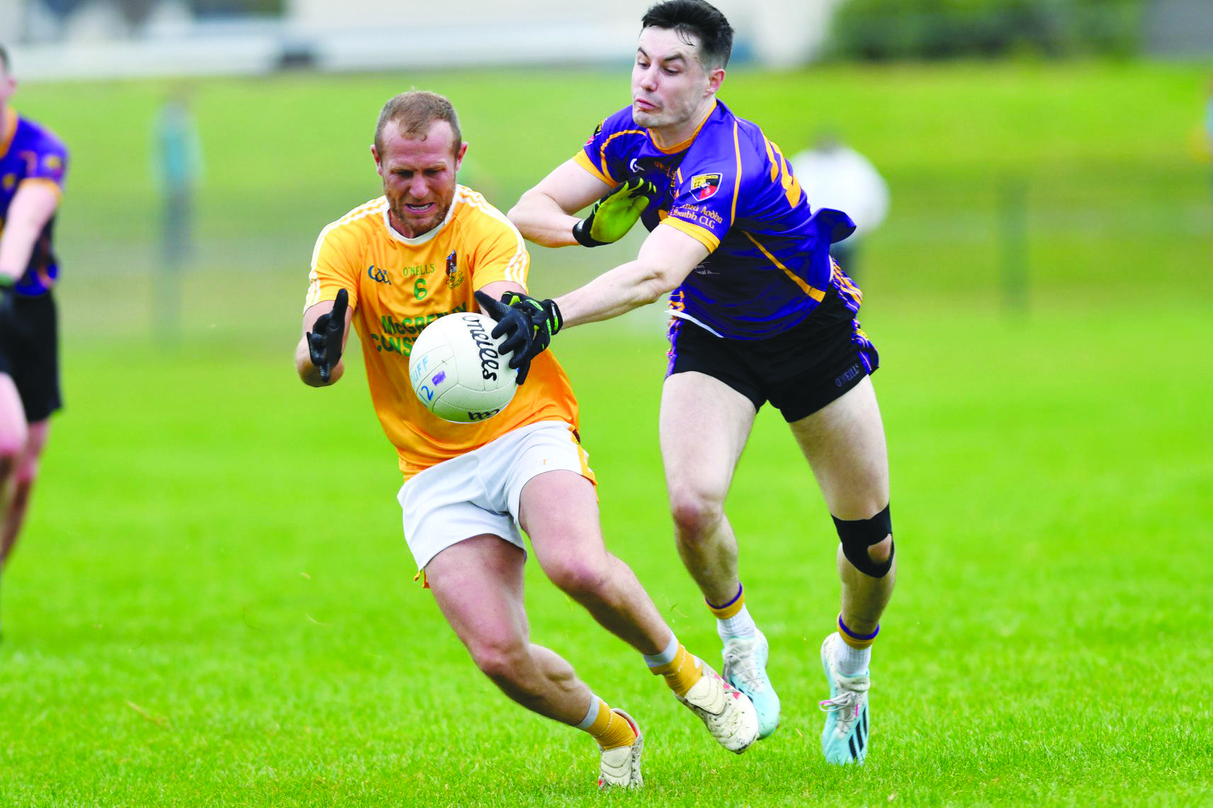 Barry O\'Hagan (Clonduff) and James Guinness (Carryduff) in action during last year\'s Down SFC quarter-final at Newcastle. The sides meet again on Monday evening in Newry