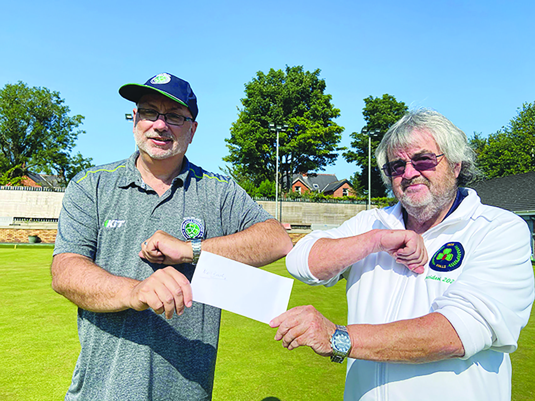 Falls Bowling Club President, Paul Anthony with Neil Booth