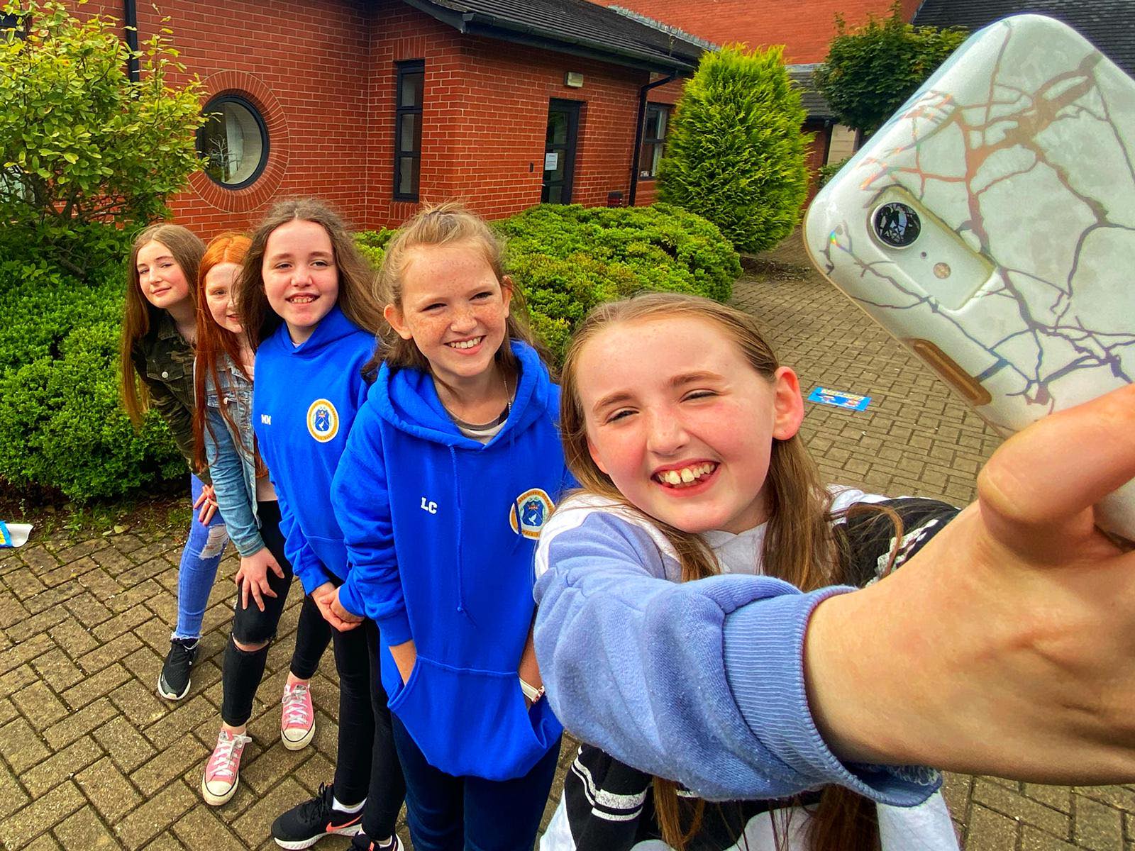 ALL SMILES: P7 pupils returned to Our Lady Queen of Peace Primary School to say their proper goodbyes to friends and teachers