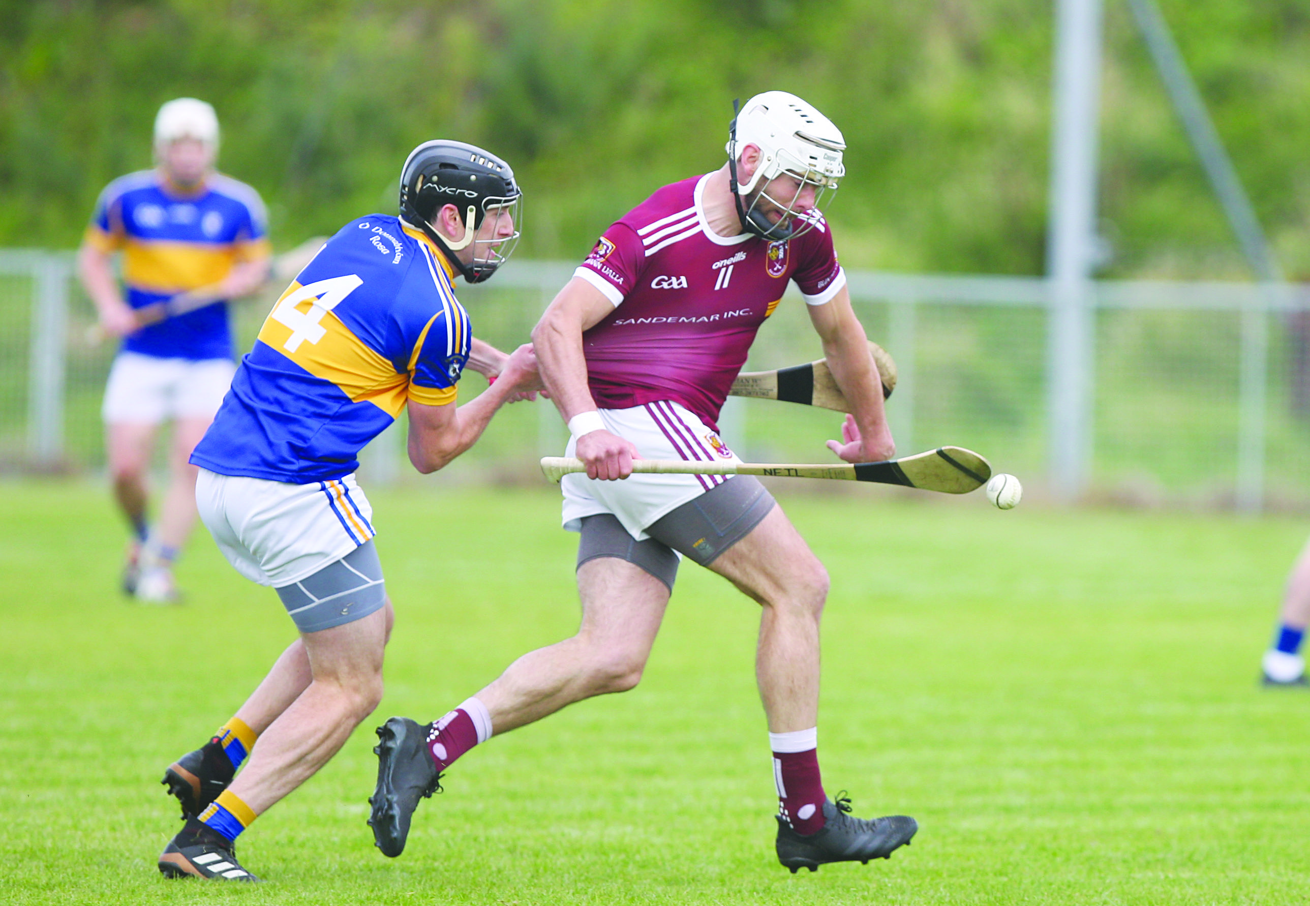 Michael Armstrong, pictured in action against Neil McManus on Saturday, is a major injury concern for Rossa ahead of Sunday’s semi-final against Dunloy