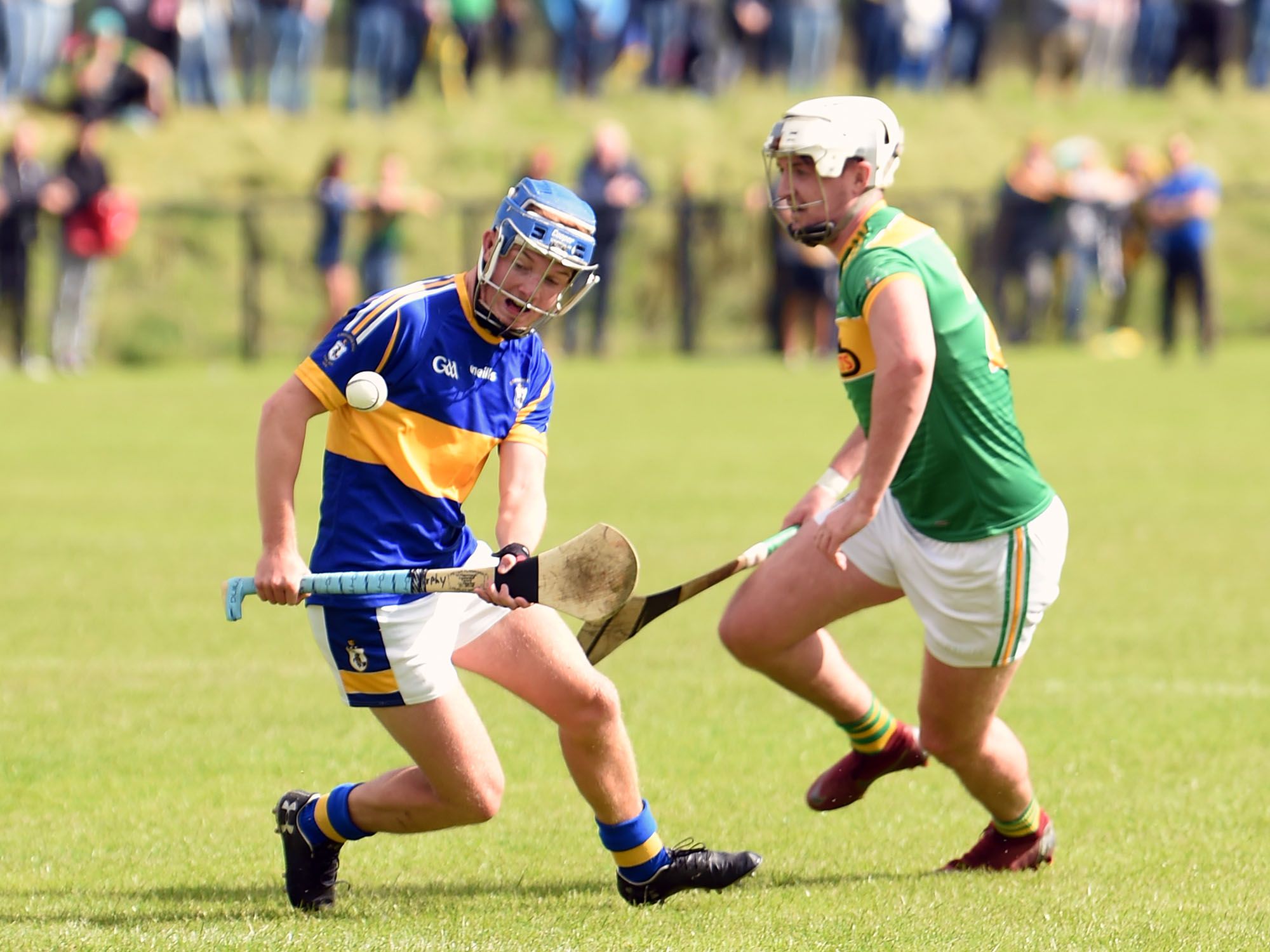 Tiernan Murphy gets out in front of Conor McKinley