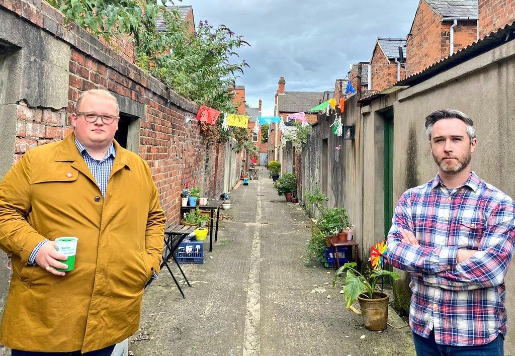 NEW LOOK: ­Councillors Séamas de Faoite and Gary McKeown in the Rushfield Avenue/ Deramore Avenue entry off the Ormeau Road