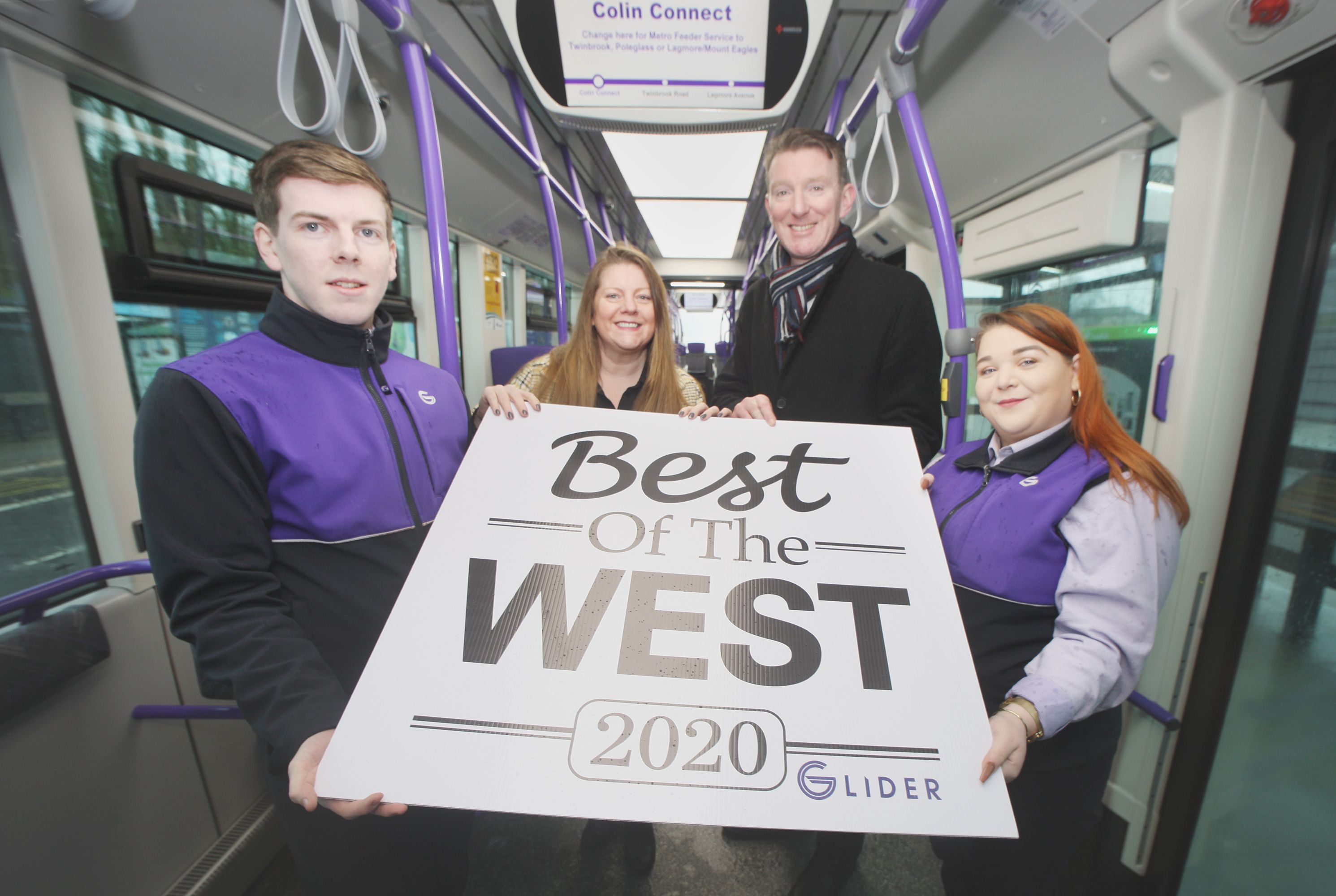 ALL ABOARD: Christina Sloan with Damian Bannon of Translink and Daire and Ruairí from the Stewartstown glider Hub