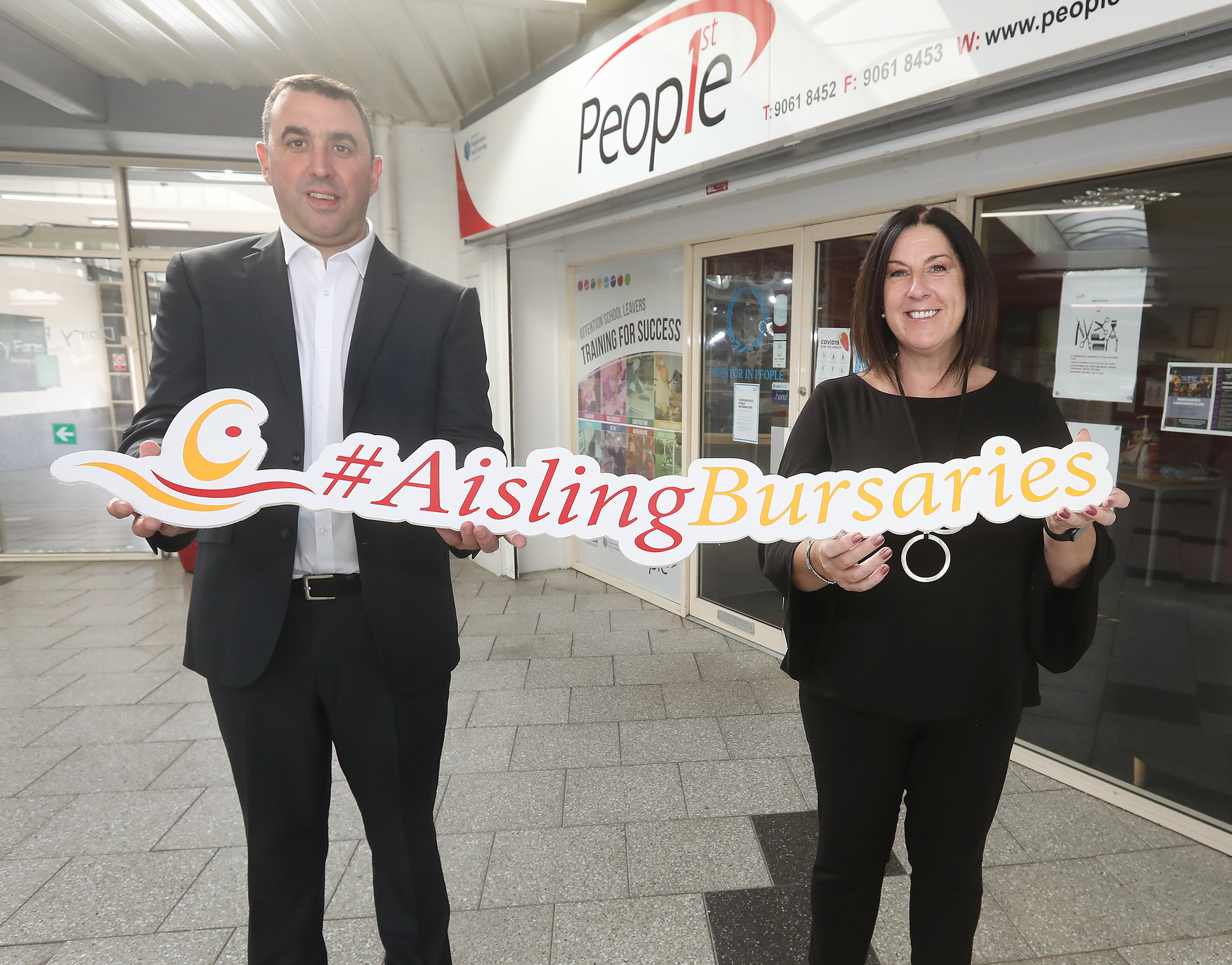 Aidan Kelly presenting the Bursary to Angie Mervyn on behalf of Shanice McCann, who is beginning a Level 3 in Childcare at Blackie River Centre. 