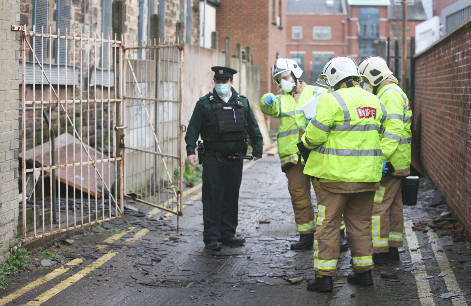 HATE CRIME PROBE: Police officers and firefighters at the scene of the attack on Friday morning