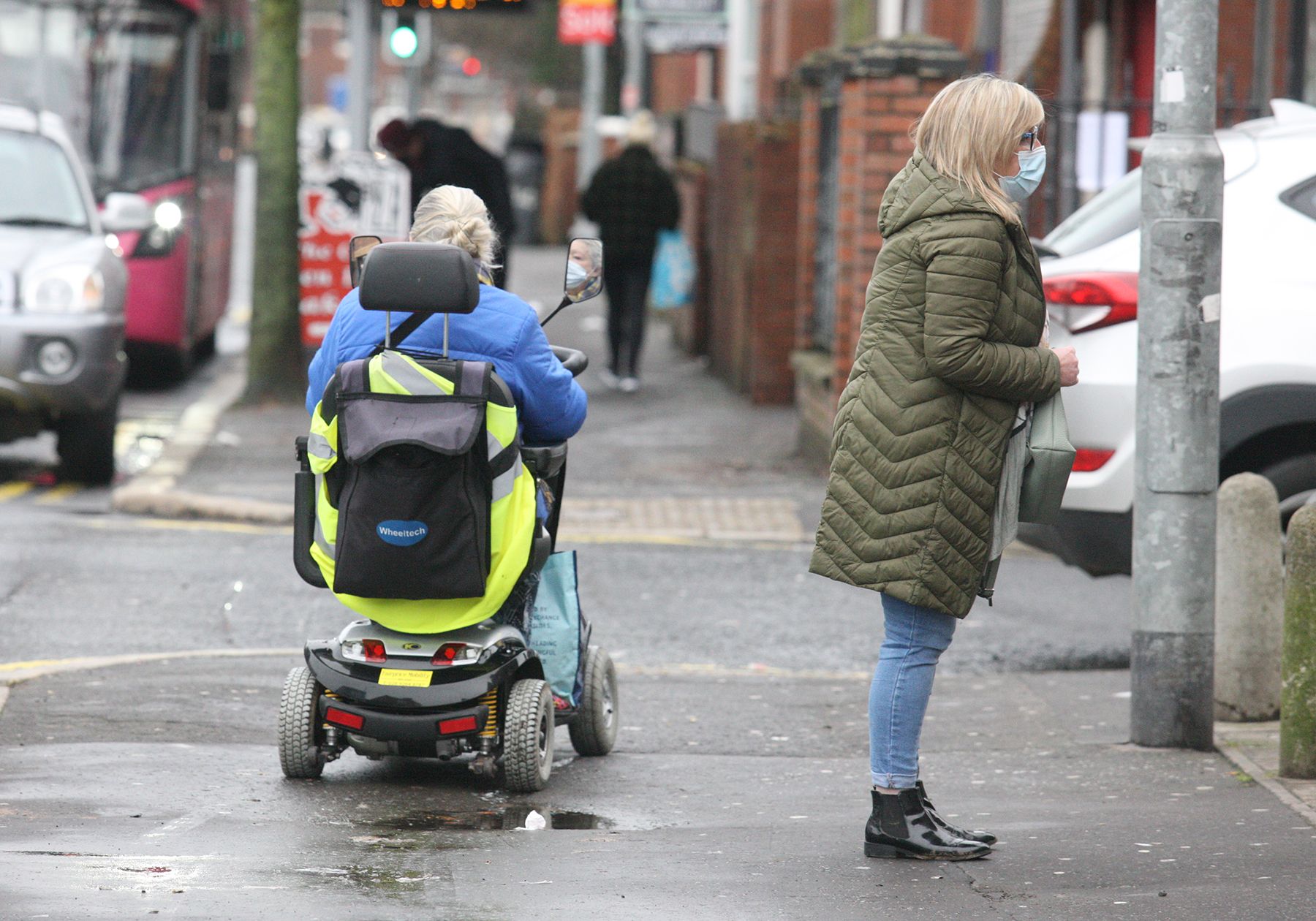 GOING ABOUT THEIR EVERY DAY BUSINESS: Face masks being worn on the Antrim Road on Thursday