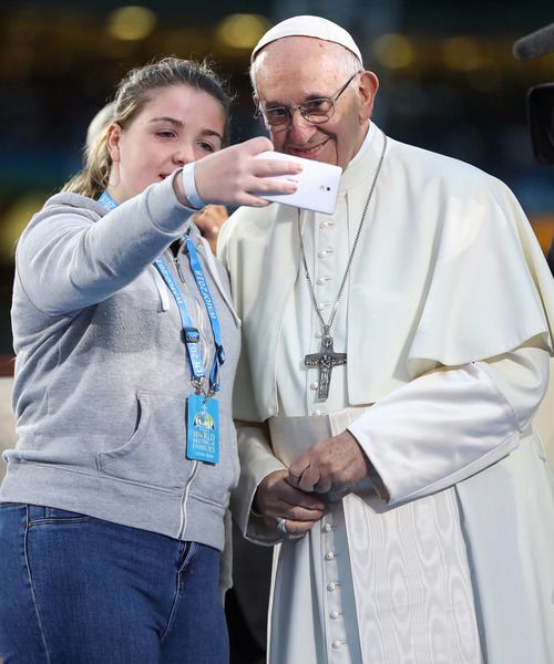 REVOLUTION:  Pope Francis, during his 2018 visit to Ireland for the World Meeting of Families, takes a selfie with Alison Nevin age 12 from the Carrickmines Traveller fire tragedy family at Croke Park.