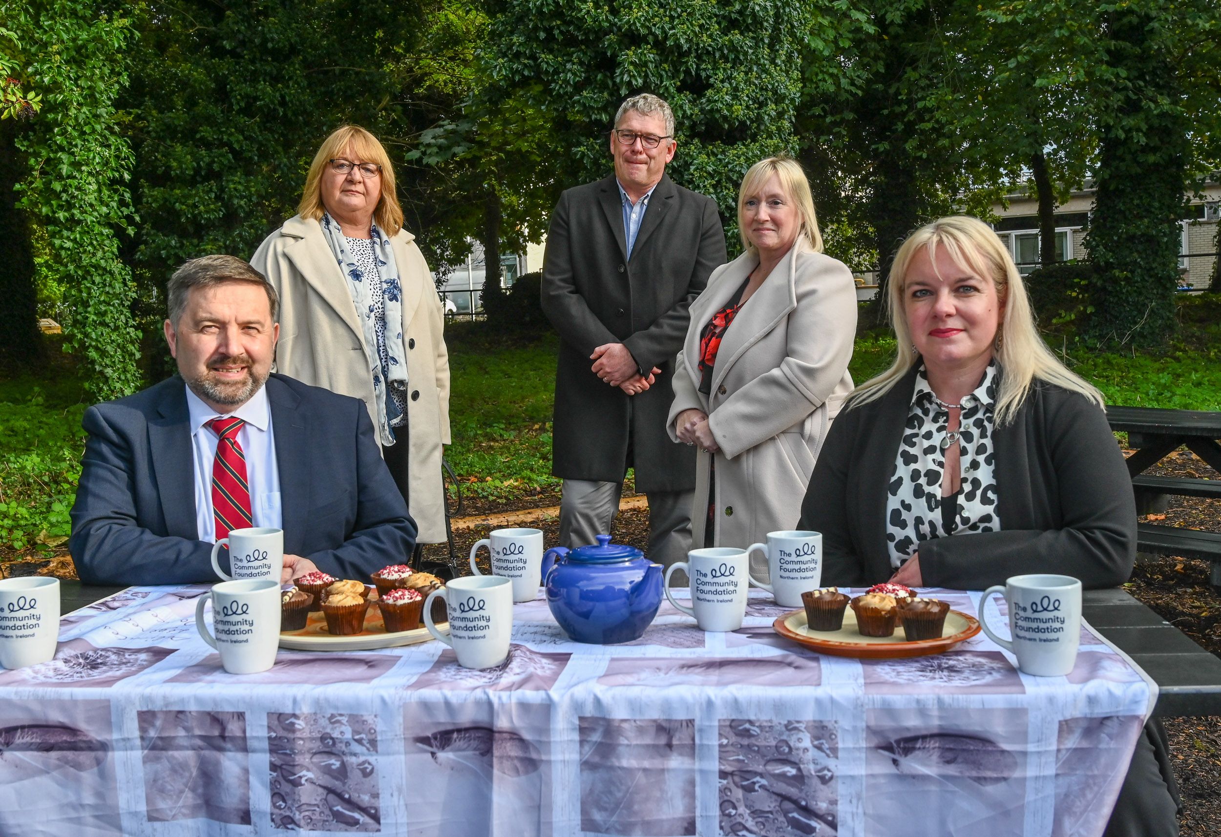 FUNDING BOOST: Health Minister Robin Swann and Orla Black (Community Foundation) with Moyra Wylie, Shane Coulter and Amanda Ashe, from Clare CIC in North Belfast