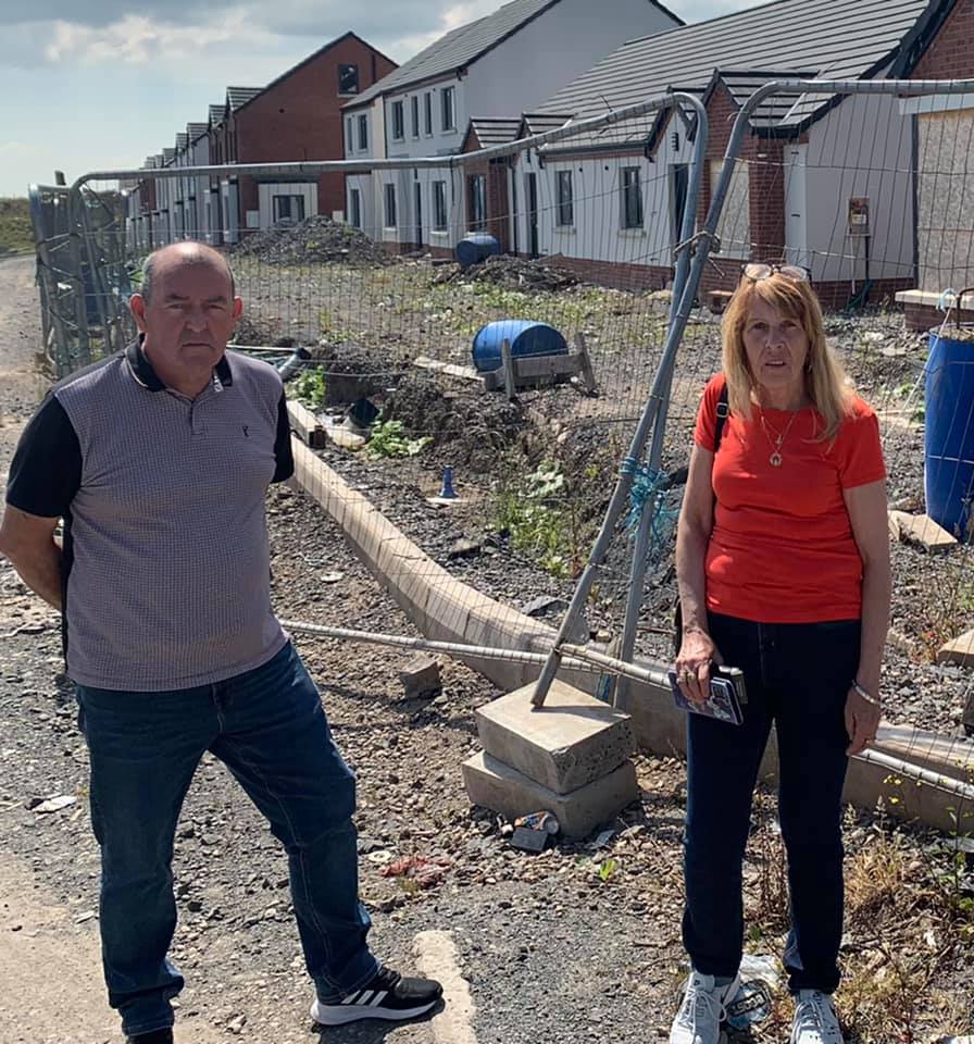 HOPE: Sinn Féin Councillor Arder Carson alongside party colleague Ann Marie Weir at the Glen Road Heights development