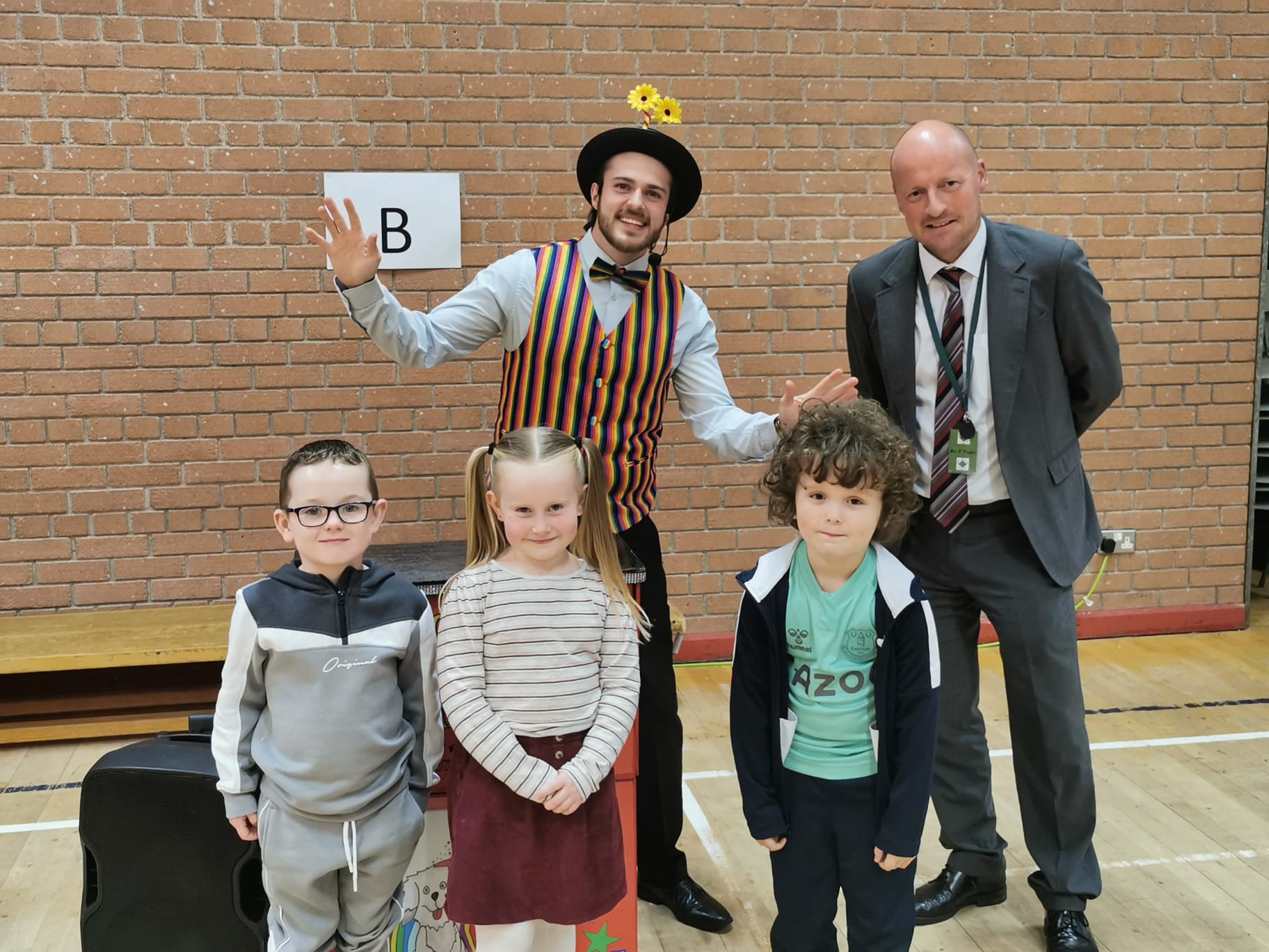 IT\'S A KIND OF MAGIC: Pupils Darren McStravick, Ayla Gray and Mason McAteer with magician Mr Giggles and principal Mr Fusco