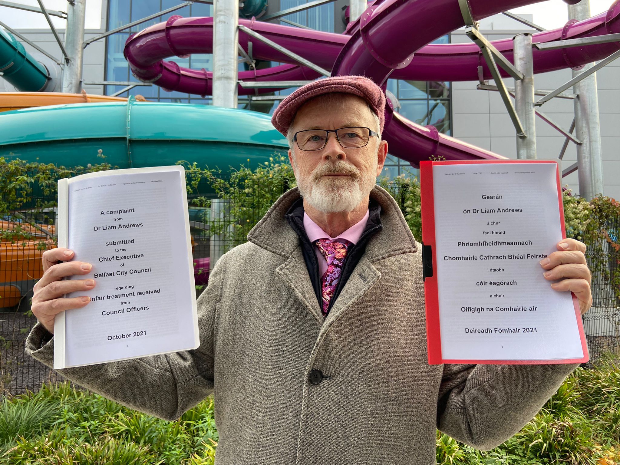 CORRESPONDENCE: Dr Liam Andrews displays bilingual copies of his complaint outside Andersonstown Leisure Centre