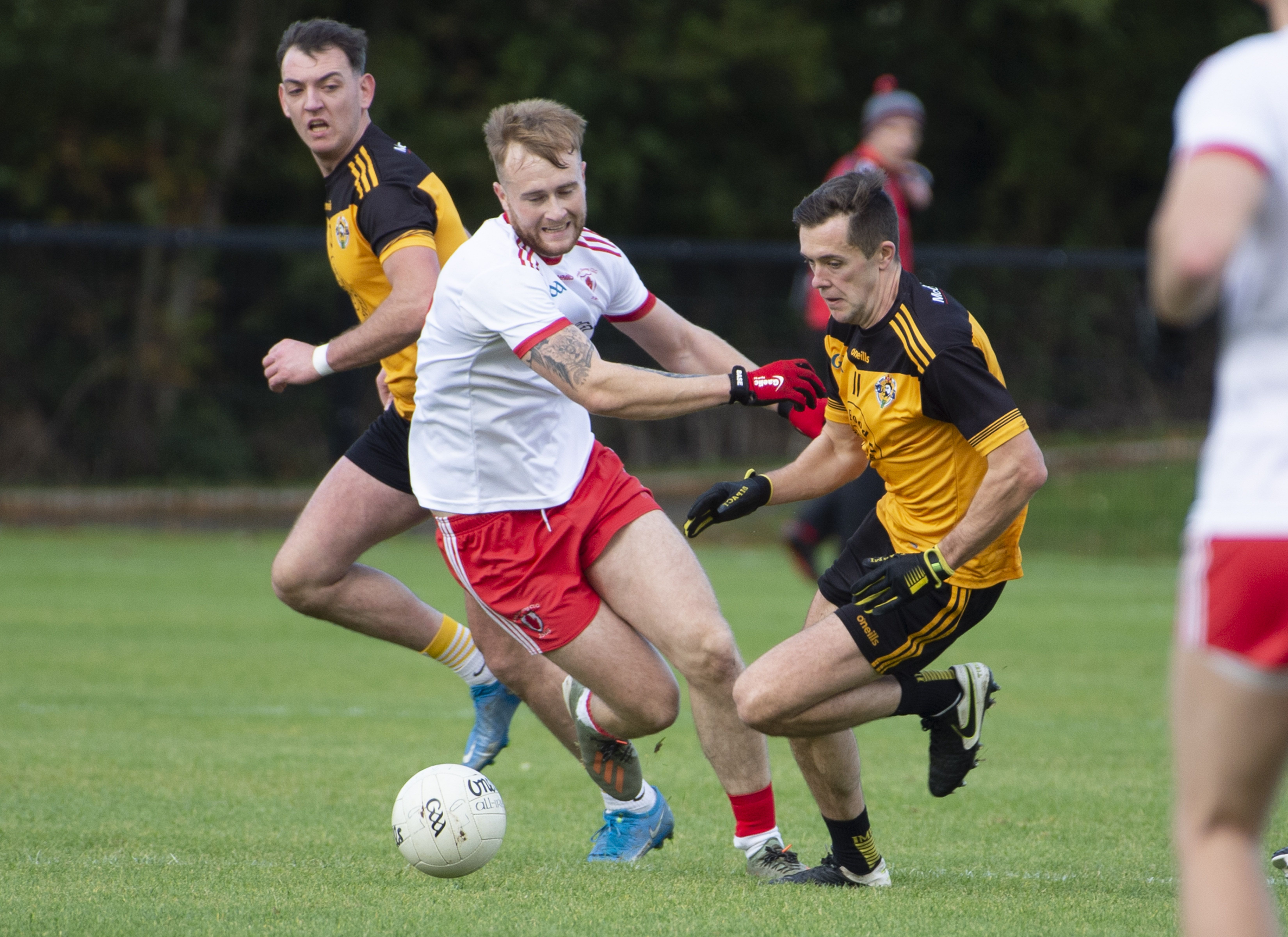 Lámh Dhearg\'s Pearse Fitzsimons and Portglenone\'s Niall Delargy fight for possession in the early stages of Sunday\'s quarter-final at Dunsilly, but Fitzsimons was forced off with an injury in the first half while Delargy was dismissed in the second 