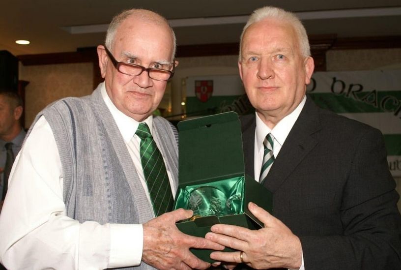 BHOYS TOGETHER: Harry Webb, left, presenting Lisbon Lion John Clark with a gift from the supporters club at an Éire go Brách annual charity night   