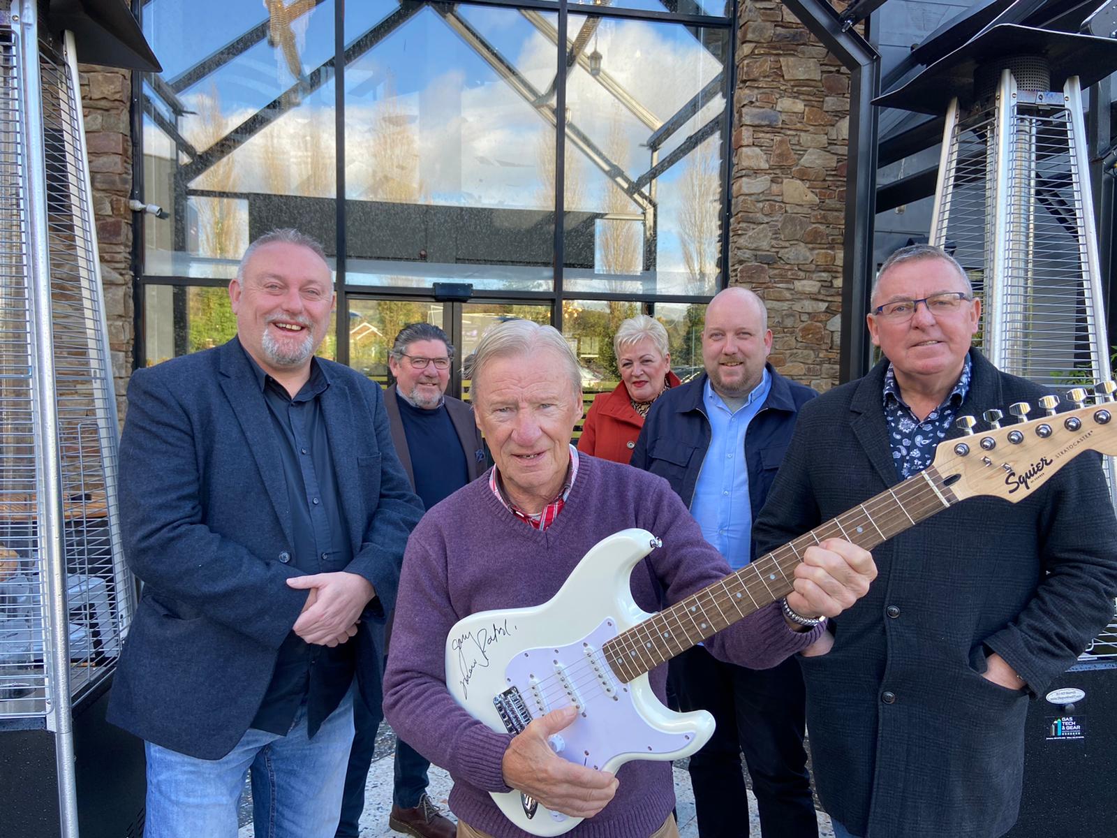 NIGHT TO REMEMBER: Gerard McNulty, Marty Faye, Tony Hagan, Carolyn McAree, Jarlath Smith, and Samie Ó\'Néill with the guitar donated by Gary Lightbody 