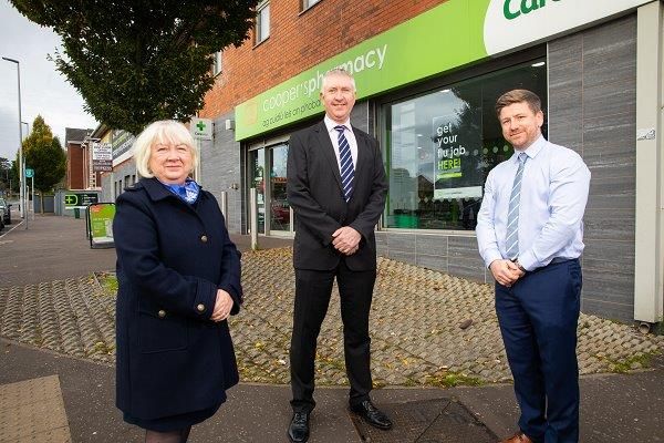 BOOSTER: Patricia Donnelly (Head of North\'s Vaccination Programme), Gerard Greene (Chief Executive of Community Pharmacy NI) and Michael Cooper (Community Pharmacist) at Cooper’s Pharmacy in Andersonstown