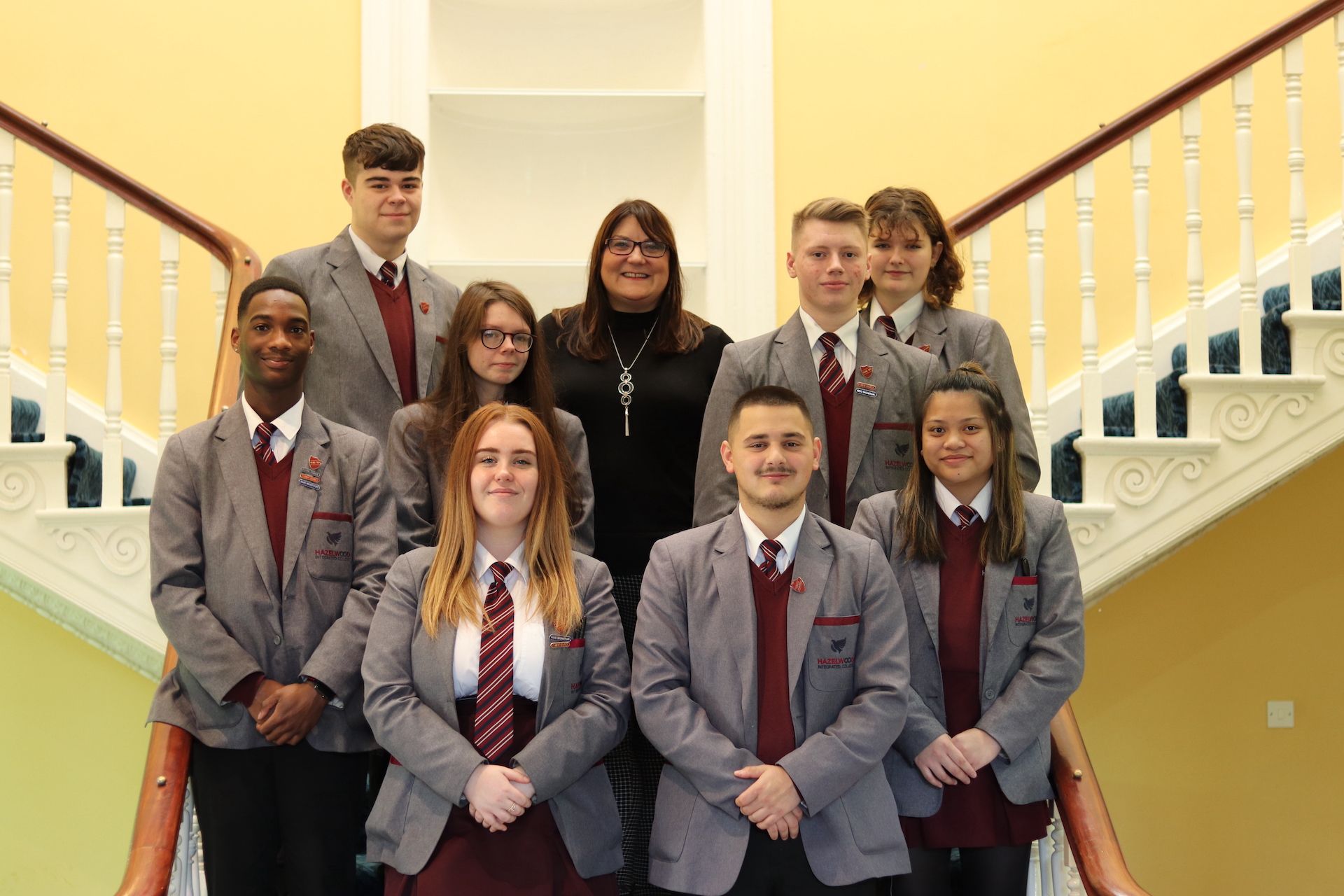 AWARD: Maria Robb with pupils from Hazelwood Integrated College