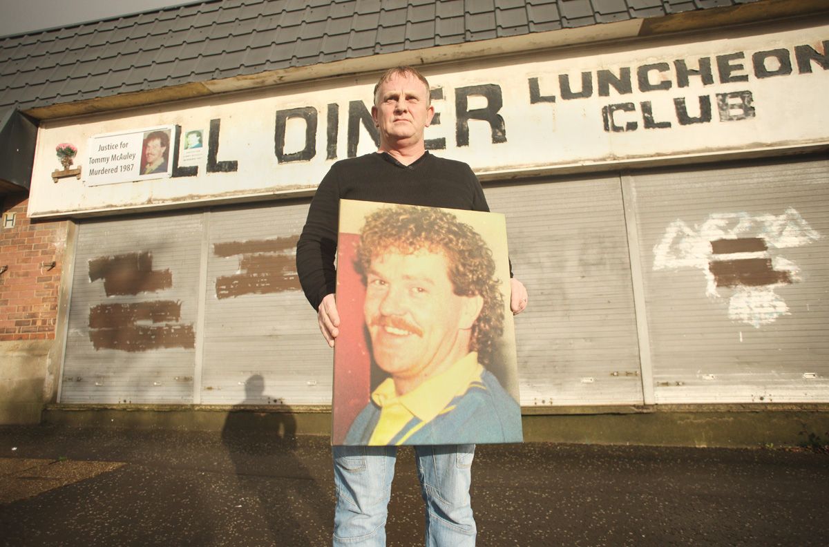 SEEKING JUSTICE: Paul McAuley in 2015 with a portrait of his brother Thomas at the scene of the 1987 murder