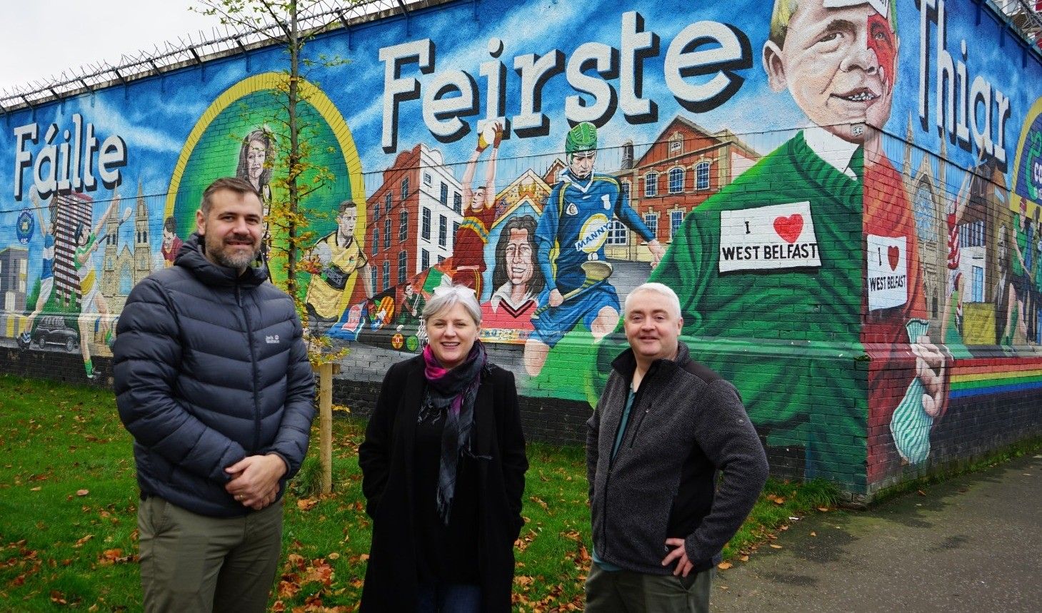 Harry Connolly Director Fáilte Feirste Thiar pictured with Peter Lynch CEO West Belfast Partnership Board and Alison Mc Crudden, Director Brassneck Youth Theatre at the west Belfast welcome mural calling for the development of Casement Park.