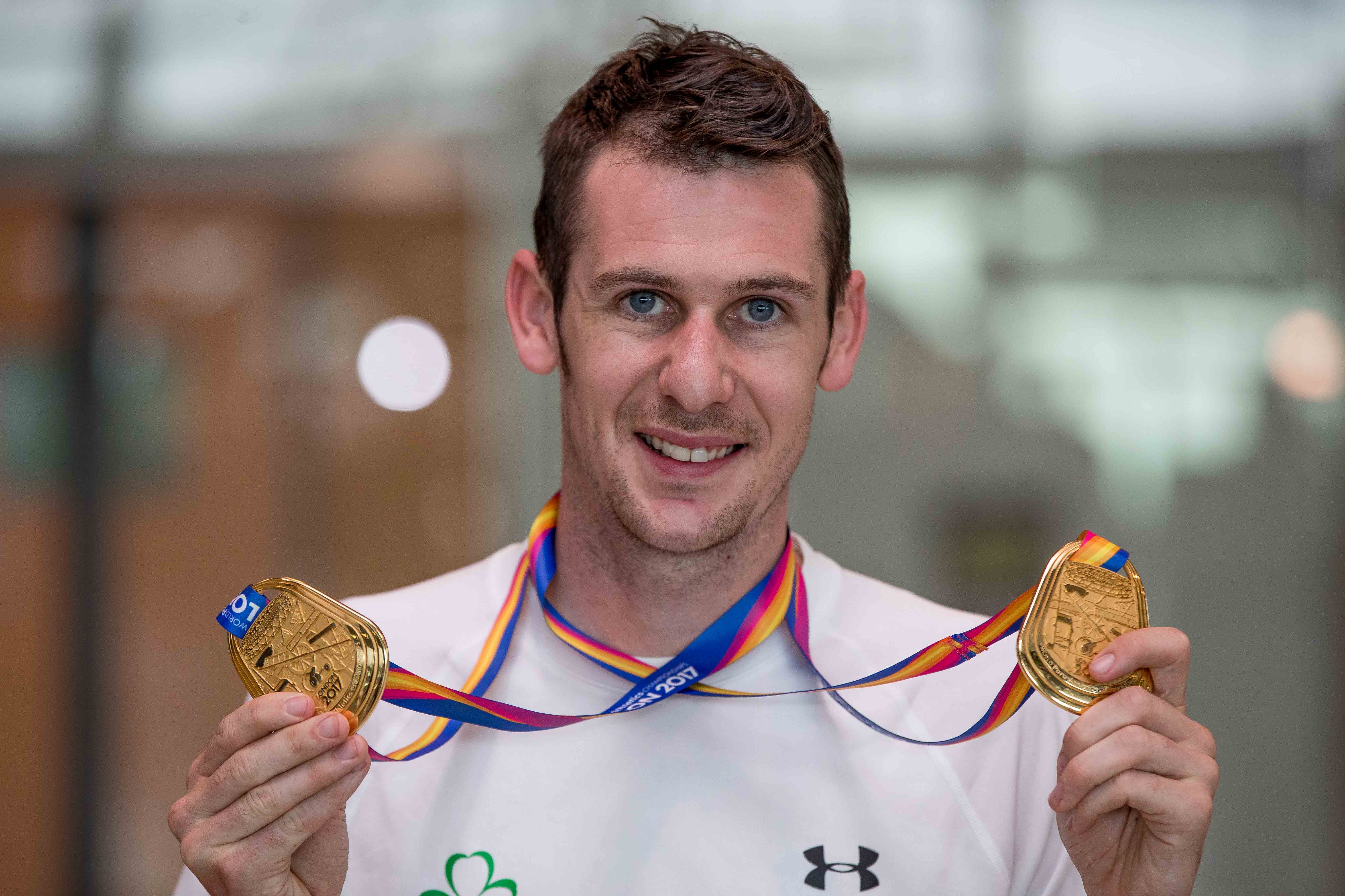 Michael McKillop with the two gold medals he won at the World Paralympic Games in London 2017