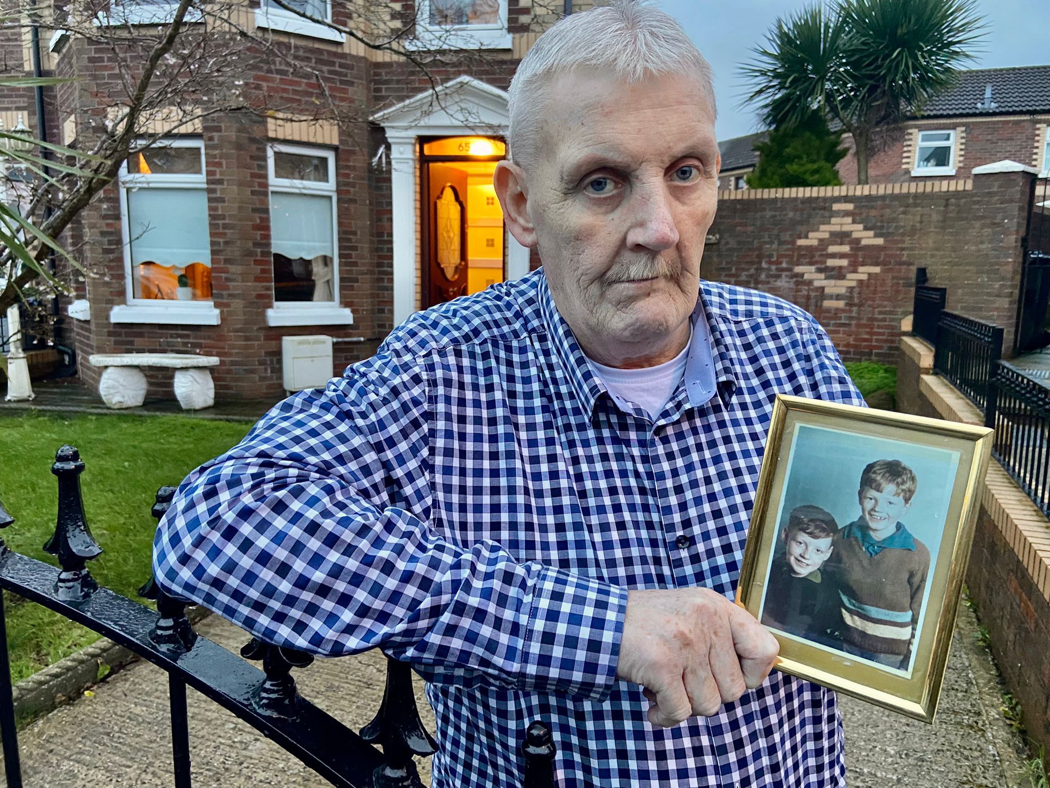 TOGETHER: Jim Rowntree holds a photo of himself and his brother Francis