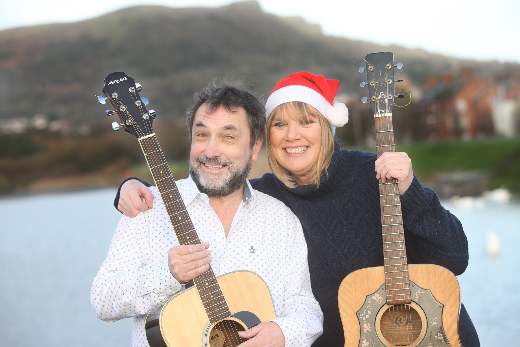 TEN GUITARS: Damian McNairney and Nuala McKeever are inviting the public to join them in Corn Market on Thursday 9 December to raise funds for The People\'s Kitchen