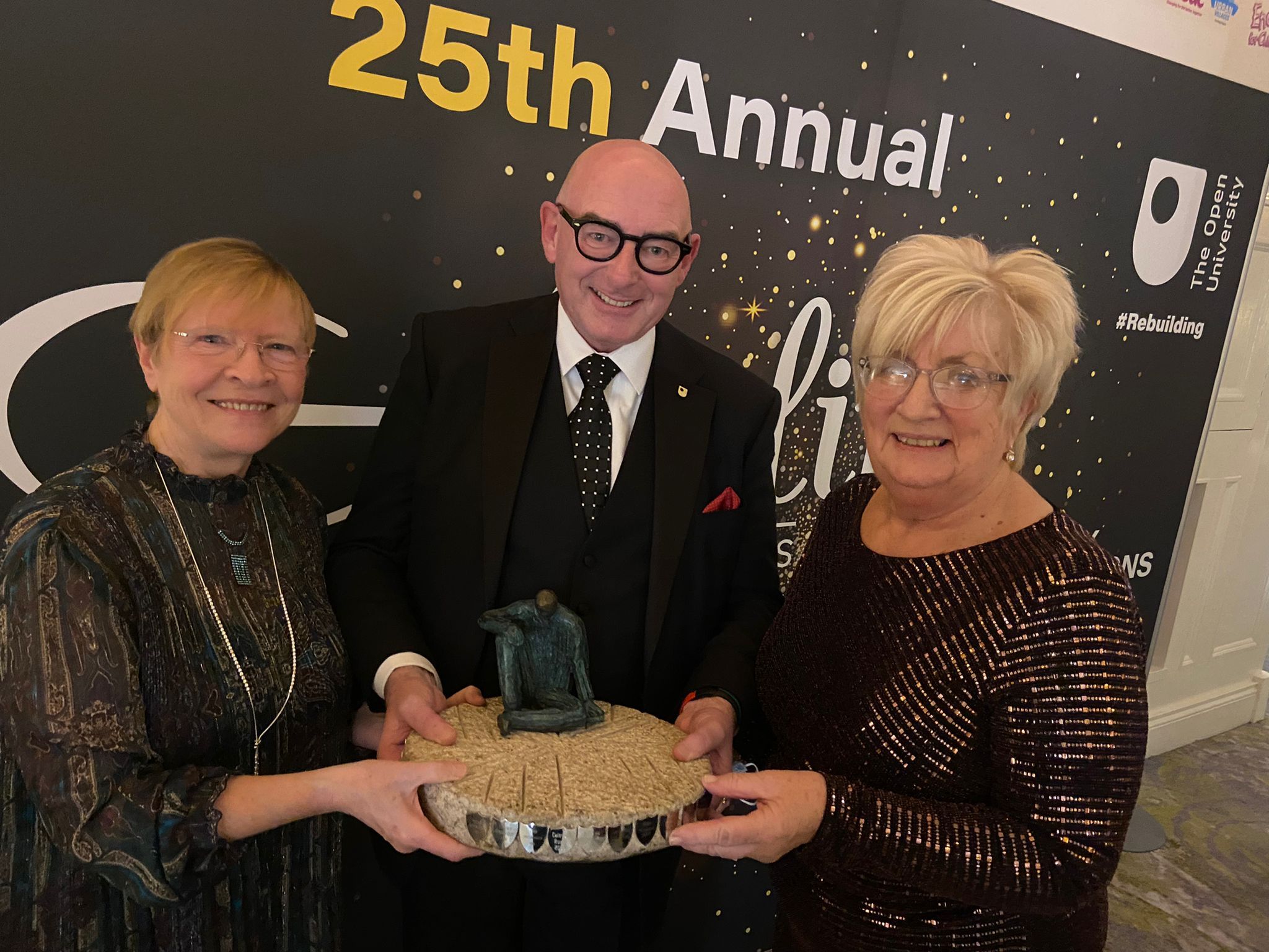 EVERDAY HEROES: John D\'Arcy, Director of Open University Ireland and premier sponsor of the Aisling Awards, presents the Person of the Year \'Wheel of Life Sculpture\' to Eilish Rooney and Monica Culbert. 
