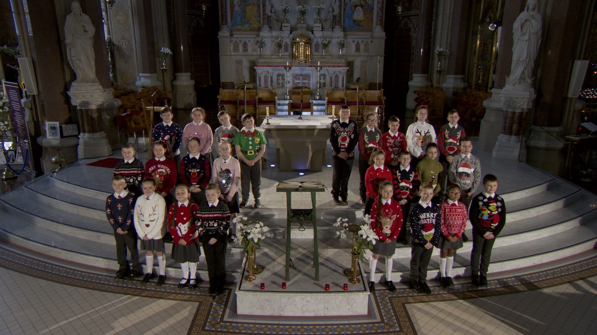 SEASON\'S GREETINGS: P7 pupils from St Kevin\'s filmed the carol service in Clonard Monastery 