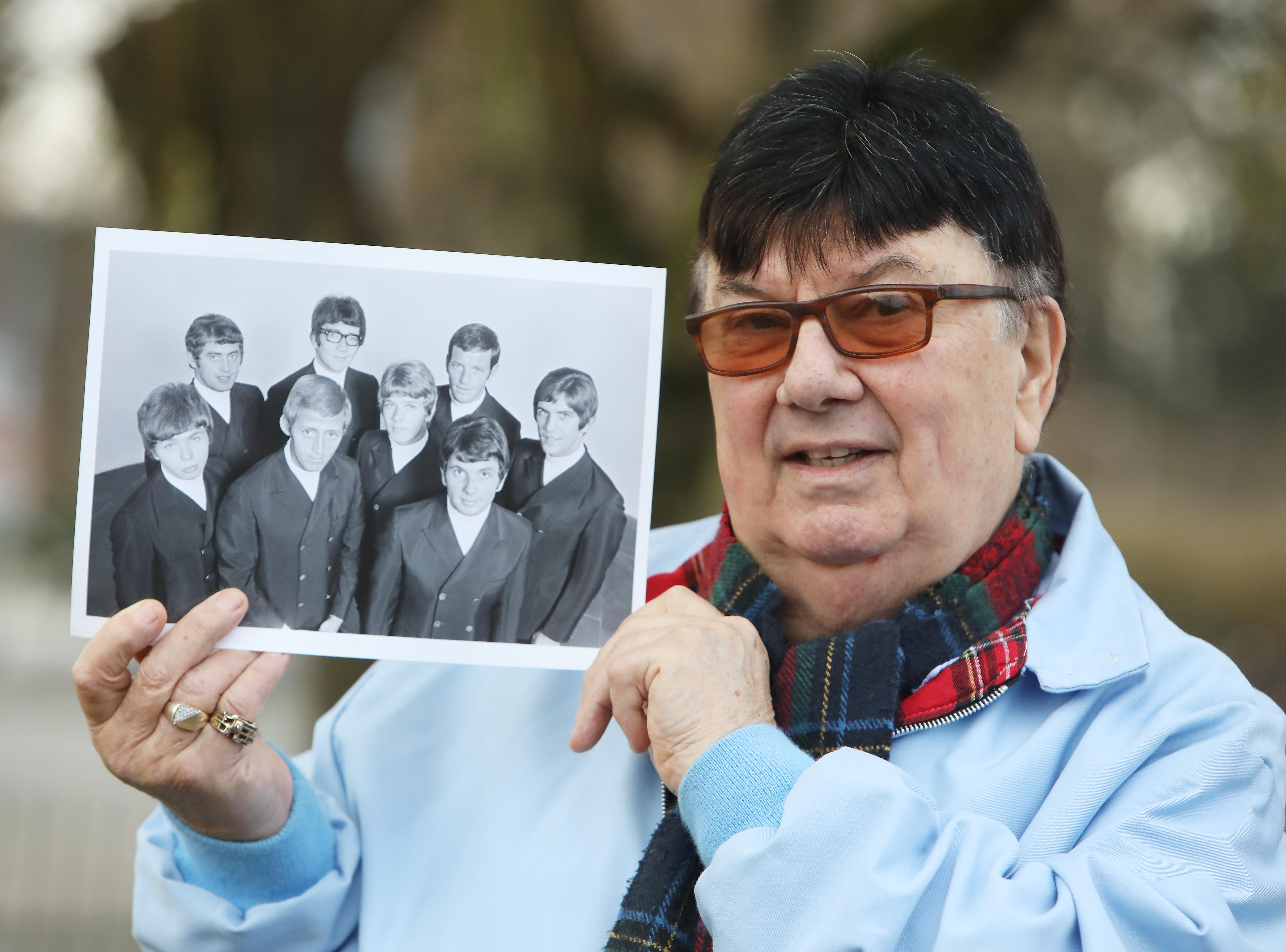 ‘BROTHERS’: Des Lee with a photo of the Miami Showband
