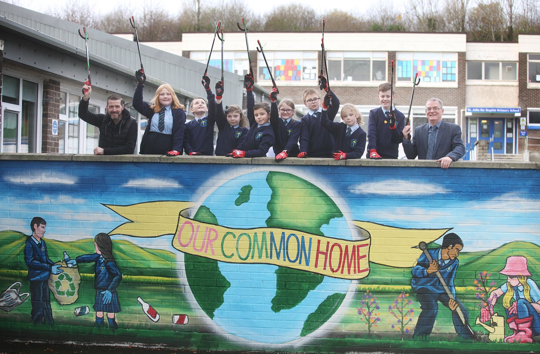 OUR WORLD: St John the Baptist Primary School celebrate the launch of their new mural