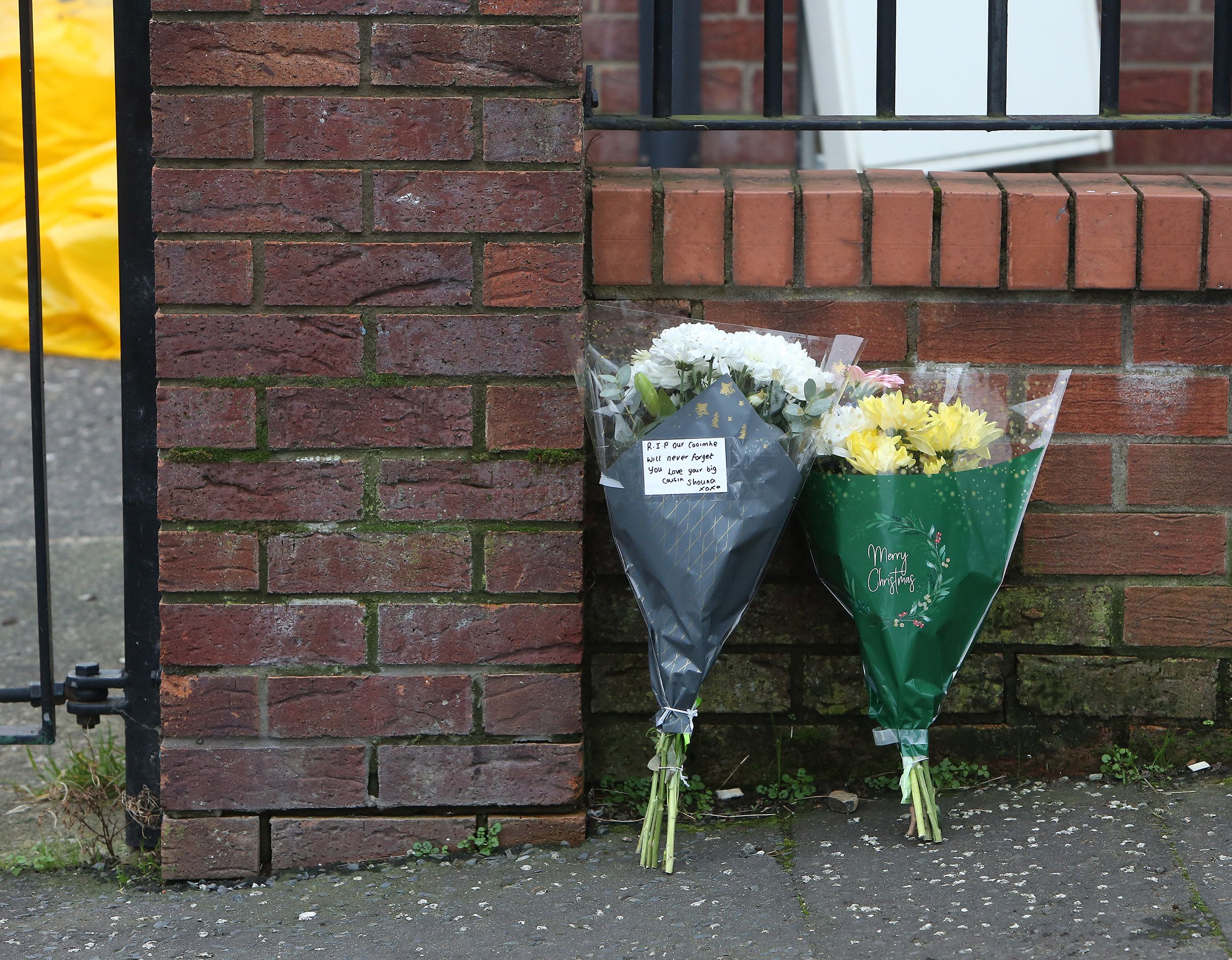 TRIBUTES: Flowers outside the house in Harcourt Drive on Sunday morning