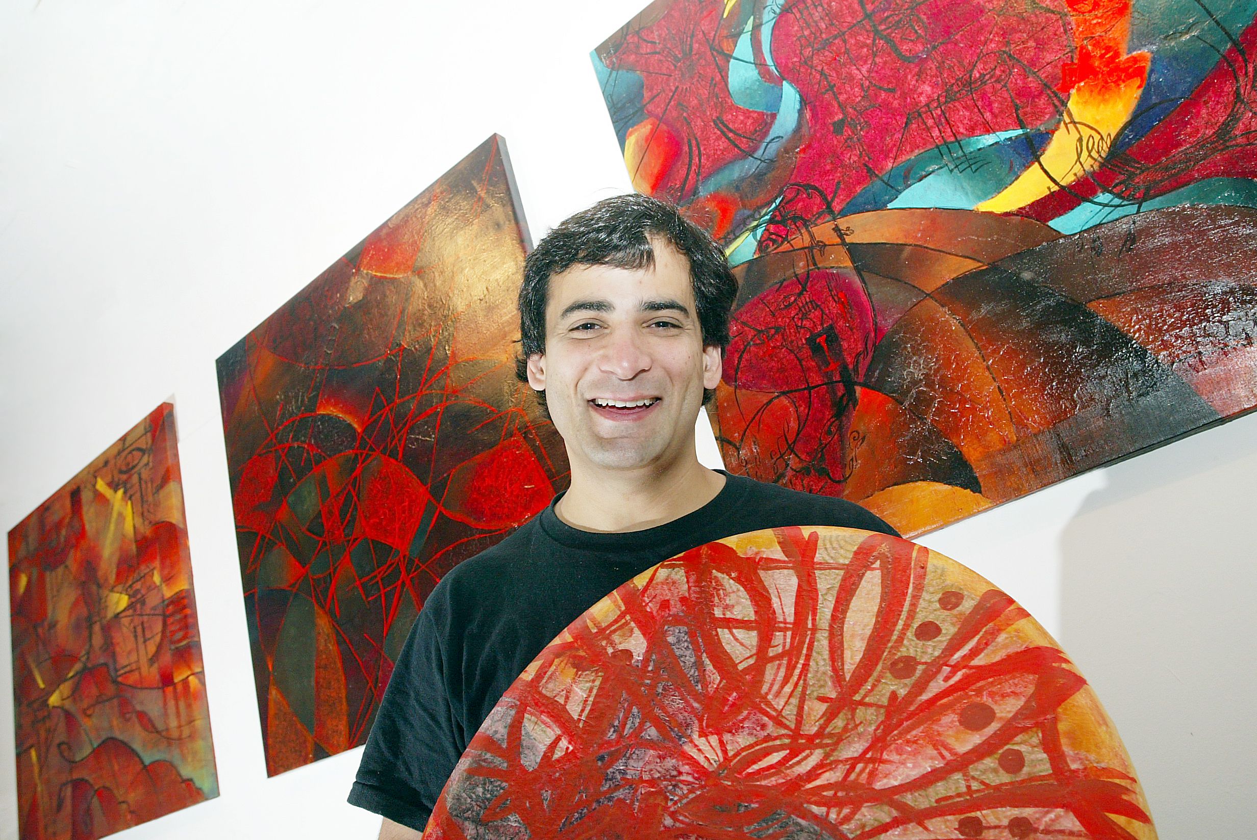 ON WAY HOME: Farhad O\'Neill with some of his artworks at Conway Mill in 2004