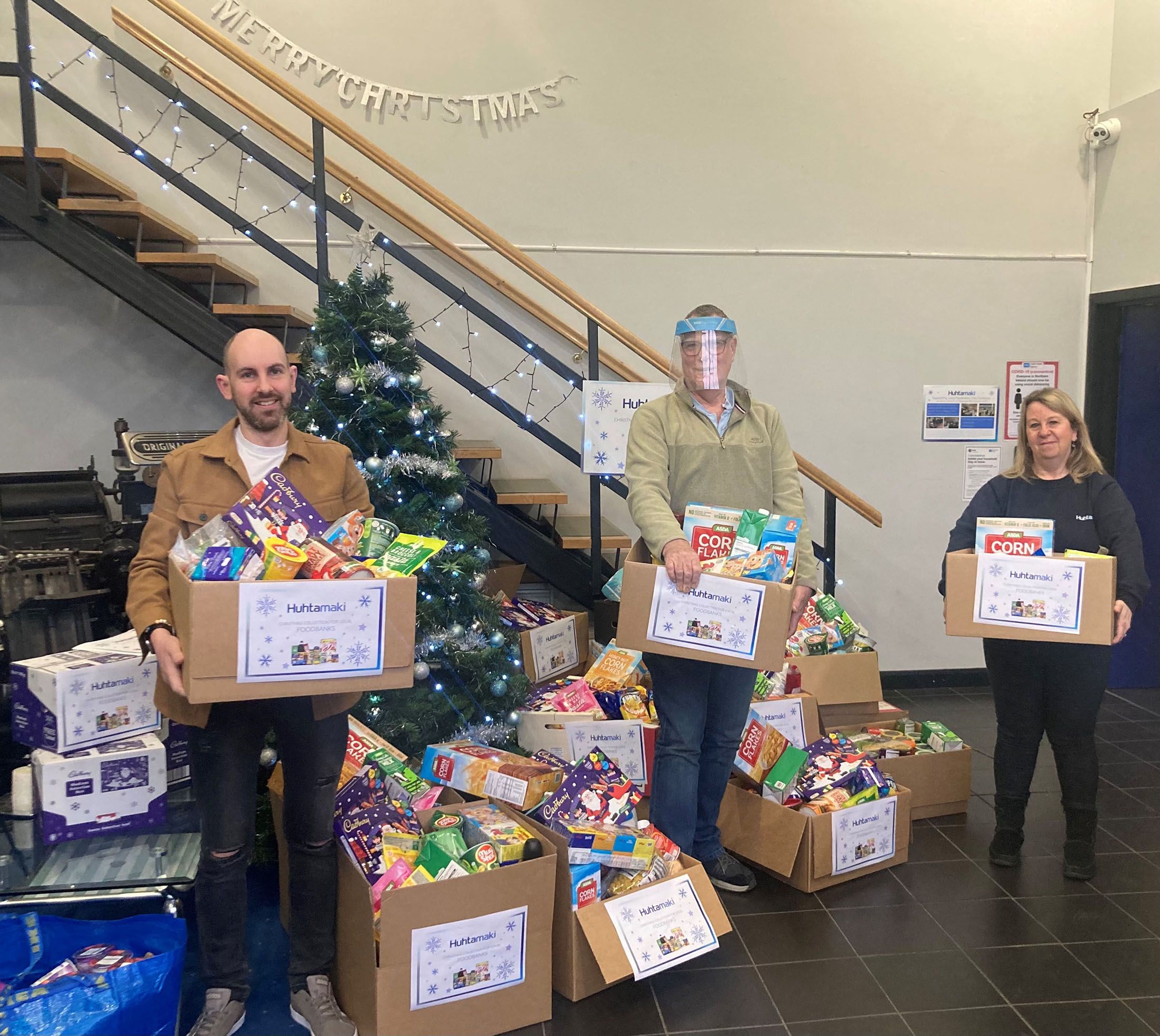 Huhtamaki Charity Committee representatives, Christopher McMahon and Janice Pagan, with Pastor Tony Meehan, Project Manager at the West Belfast Foodbank