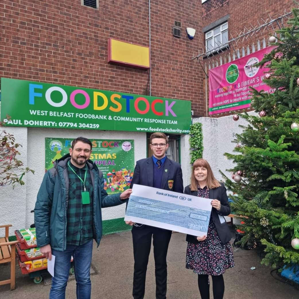 GIVING: Veronica Hanna, Key Stage Five Manager at De La Salle College and Head Boy Jack Hill presented Paul Doherty with a cheque for £500 towards their Christmas appeal 