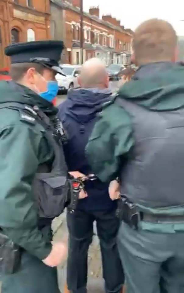 COMMUNITY FURY: Survivor Mark Sykes is arrested by the PSNI after the 29th anniversary vigil for the five Lower Ormeau residents murdered in the horror attack on Sean Graham\'s bookmaker\'s in February 1992.