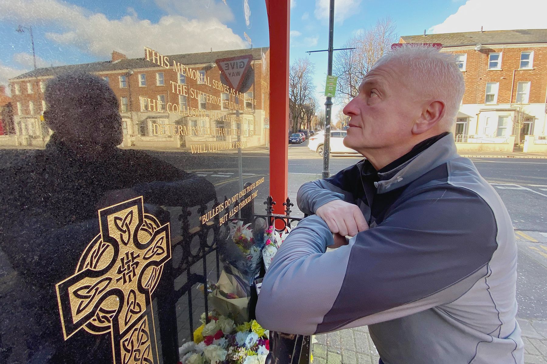 SEARCHING FOR TRUTH: Tommy Duffin looks at the memorial to his father Jack and the four other victims of the Sean Graham massacre