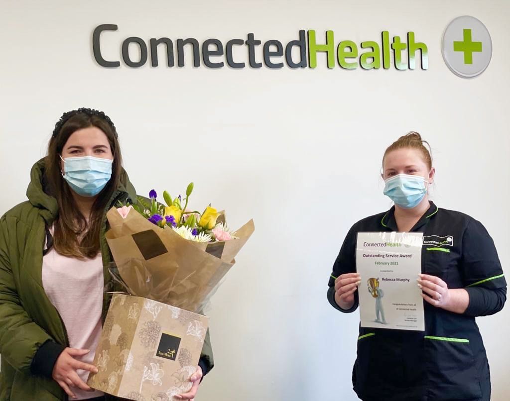 HERO: Rebecca receives flowers from Sarah-Louise McNally who is the Connected Health manager for Finaghy