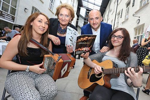 THE WAY WE WERE: Féile an Phobail Director Kevin Gamble and Arts Council Chief Roisin McDonough get in the Féile mood with local trad musicians