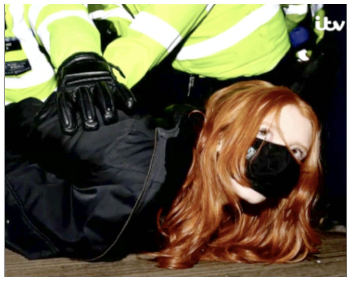 ARREST: Patsy Stephenson is held by Met Police in an iconic image from the Sarah Everard demo